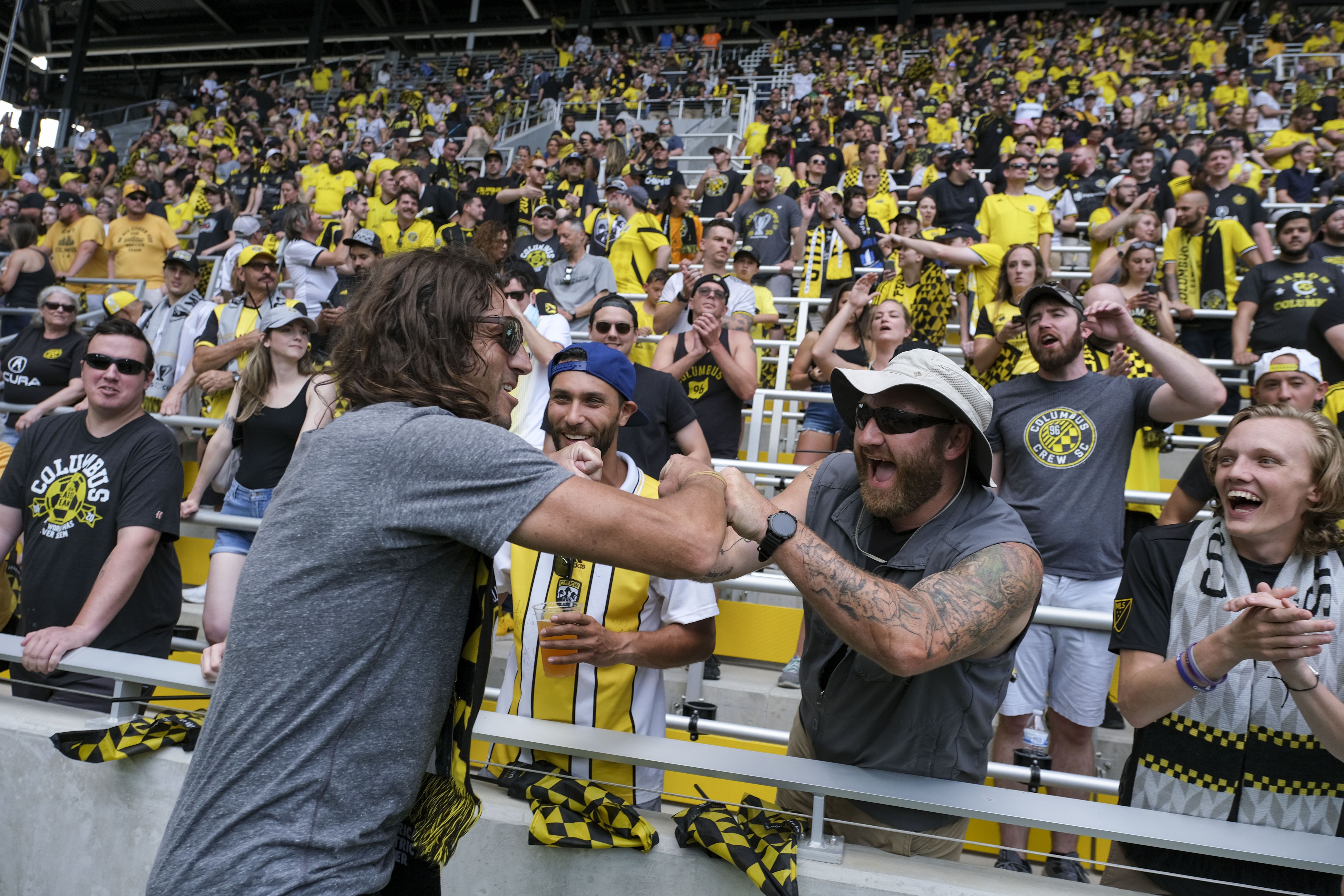 Columbus Crew soccer fans are seen in the stands before a contest. 