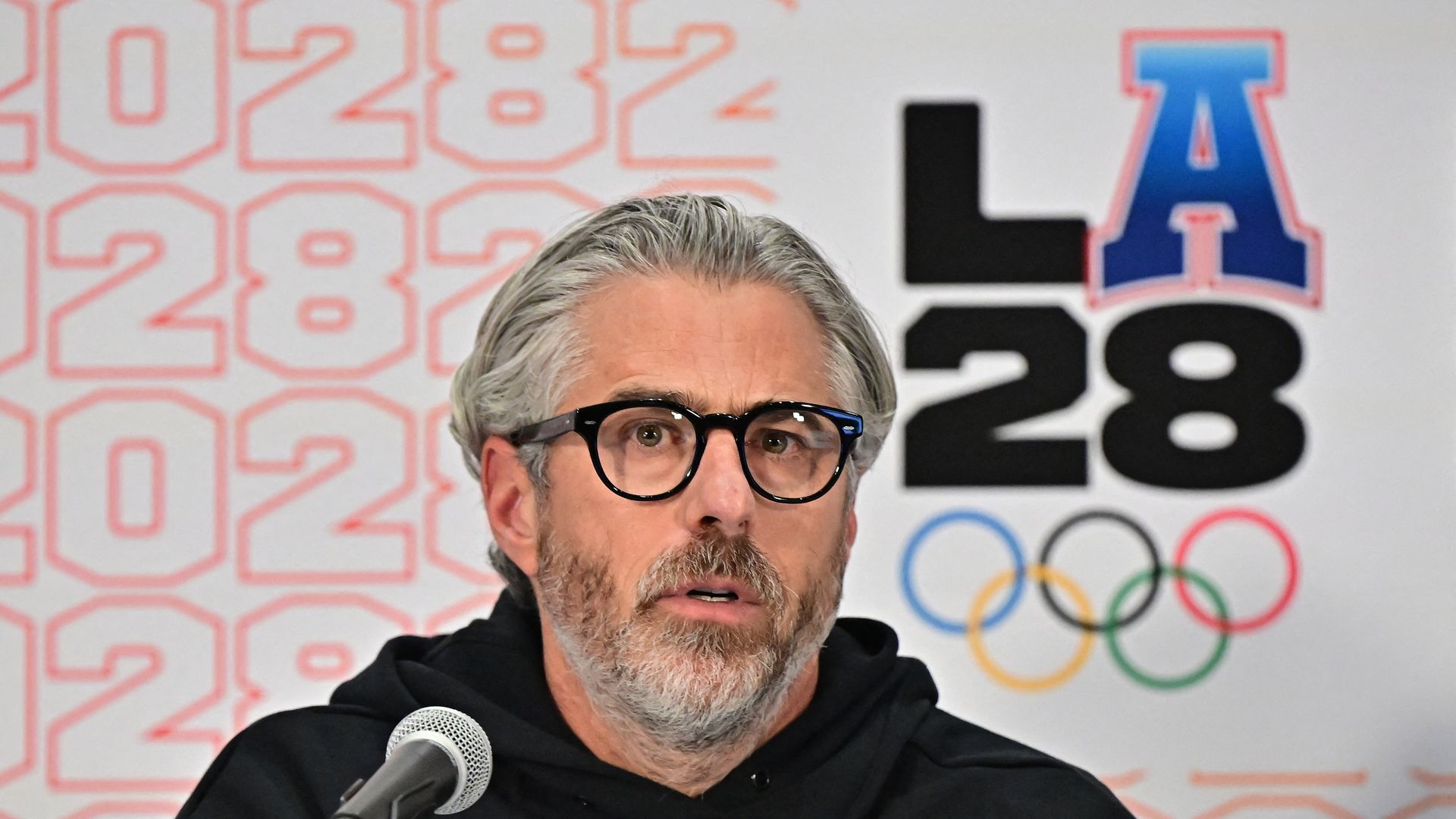 Casey Wasserman speaks at a press conference with IOC officials about the 2028 Los Angeles Olympic and Paralympic Games.