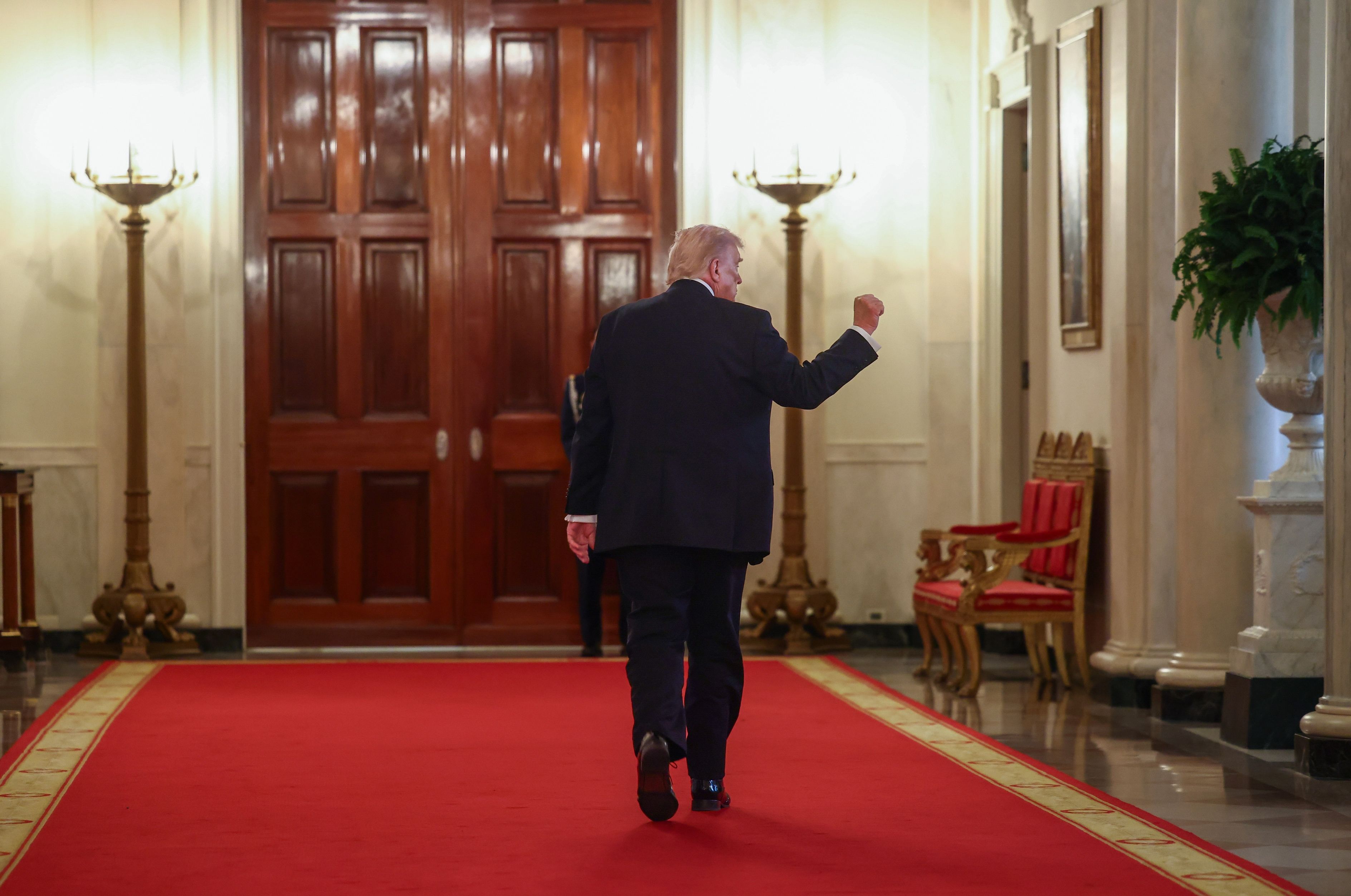 President Trump departs a Medal of Honor ceremony at the White House yesterday.
