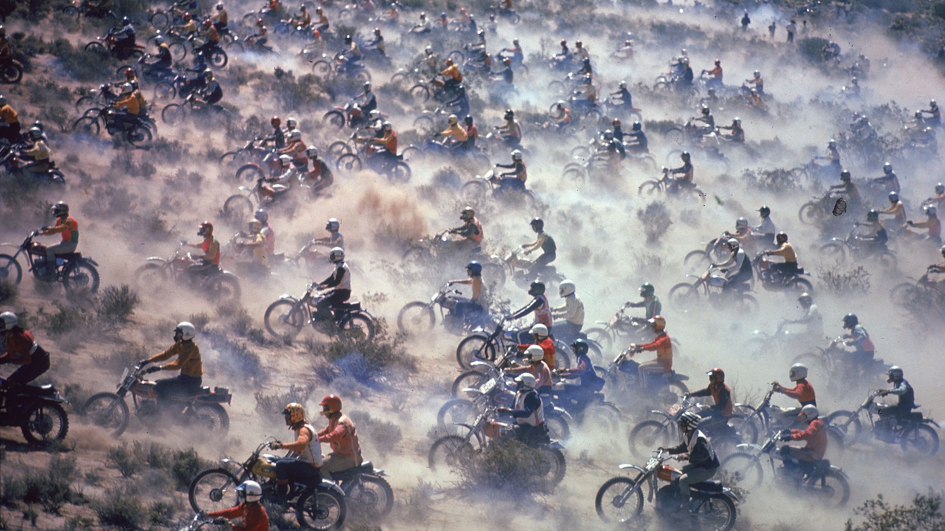 A flurry of motorcycles, racing