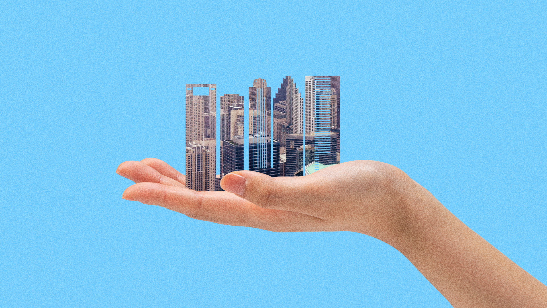 An illustration showing a hand holding a city skyline. 