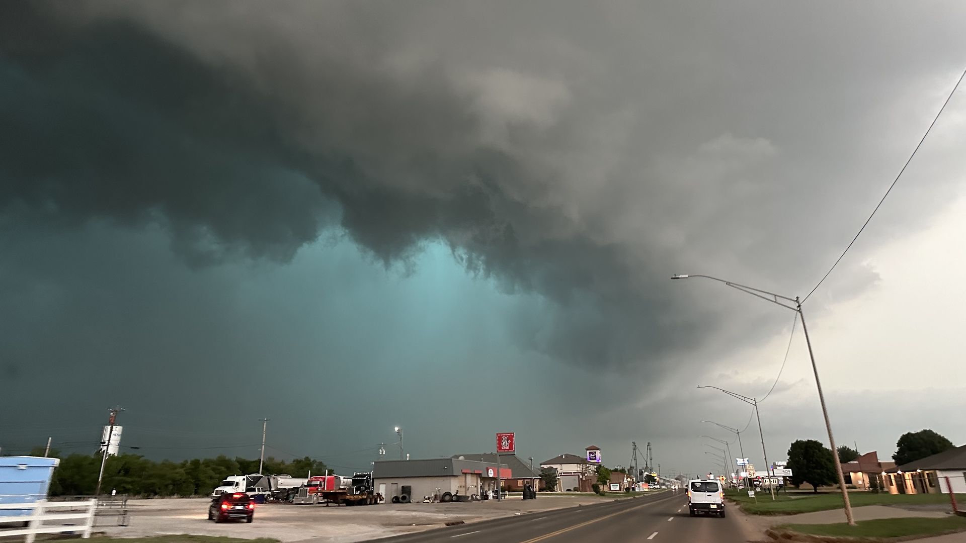 A view of mesocyclone and green glow from very large hail as a tornadic high precipitation supercell arrives in Hennessey, Oklahoma, United States on Tuesday.