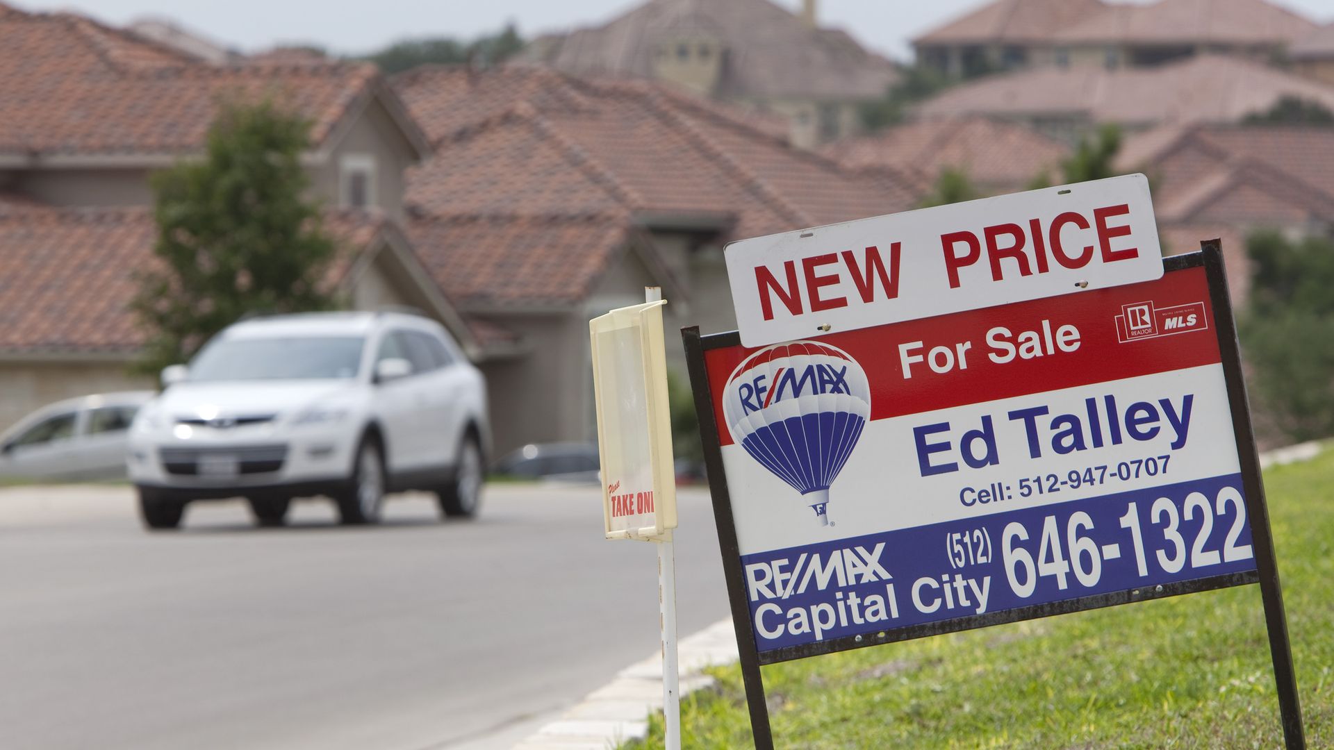 A for-sale sign outside an Austin area home.