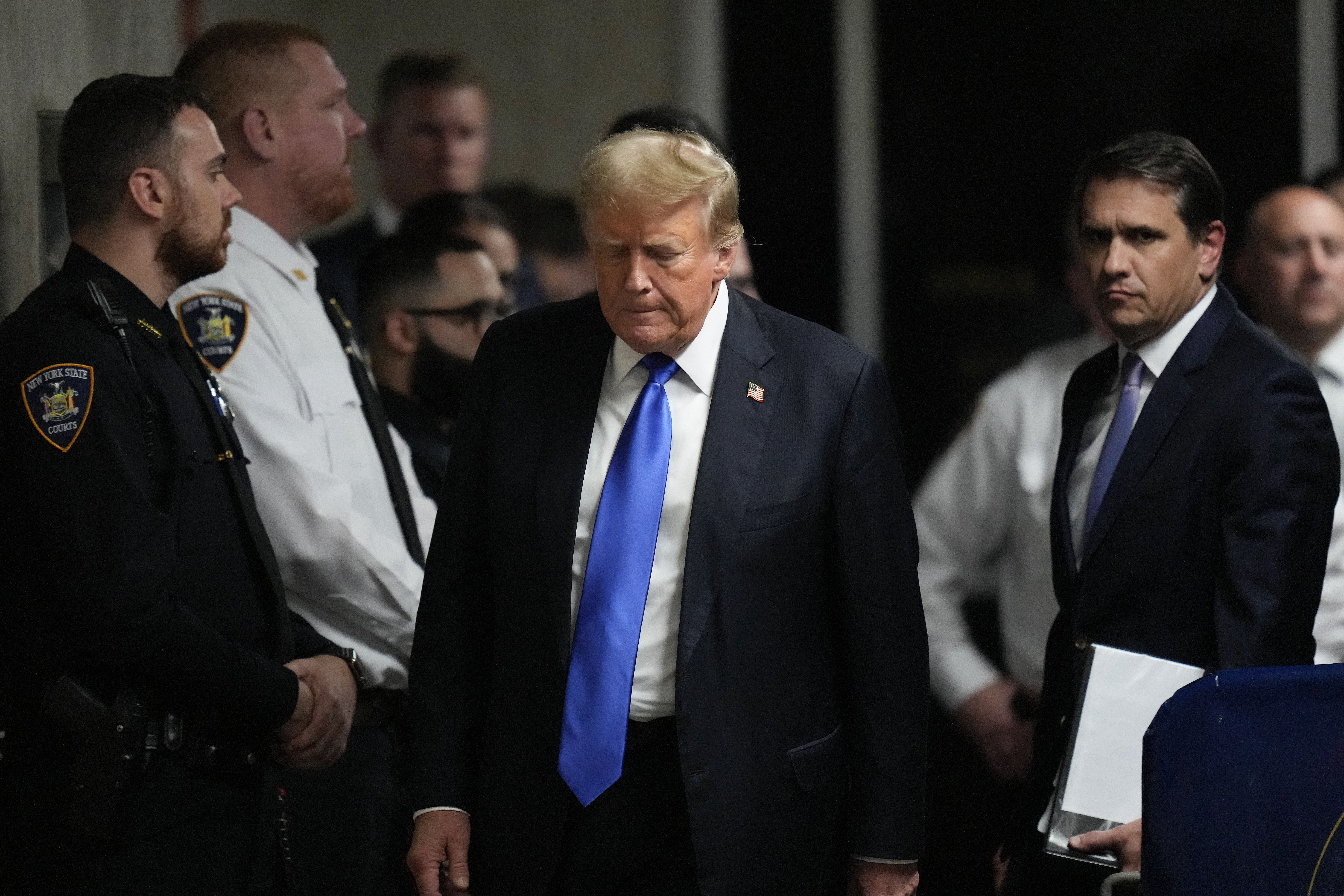 Former President Donald Trump walks to make comments to members of the media after a jury convicted him of felony crimes for falsifying business records in a scheme to illegally influence the 2016 election, at Manhattan Criminal Court, Thursday, May 30, 2024, in New York. 