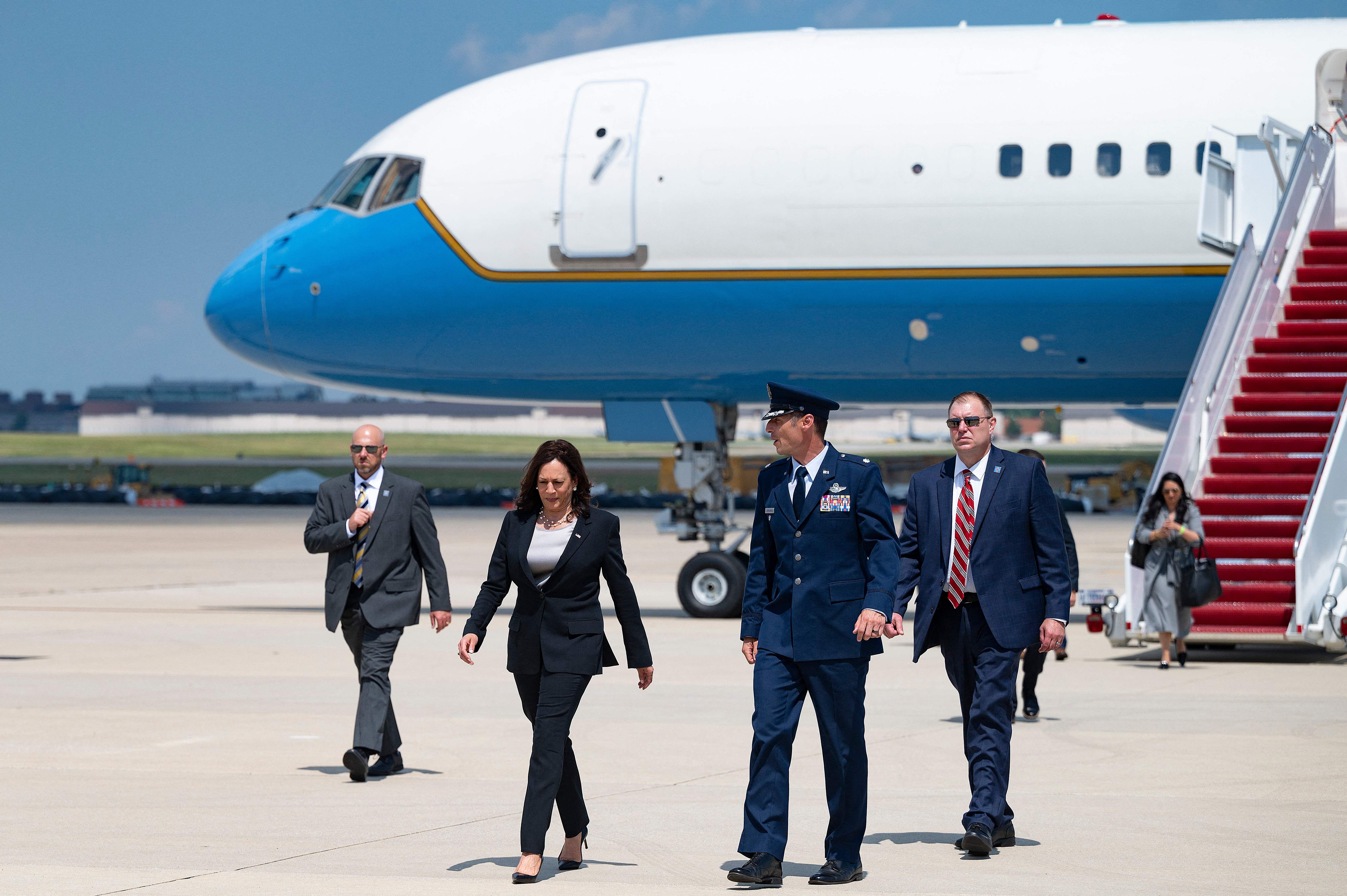 Vice President Kamala Harris is seen walking away from Air Force Two after it had to return to Joint Base Andrews after suffering a technical problem.