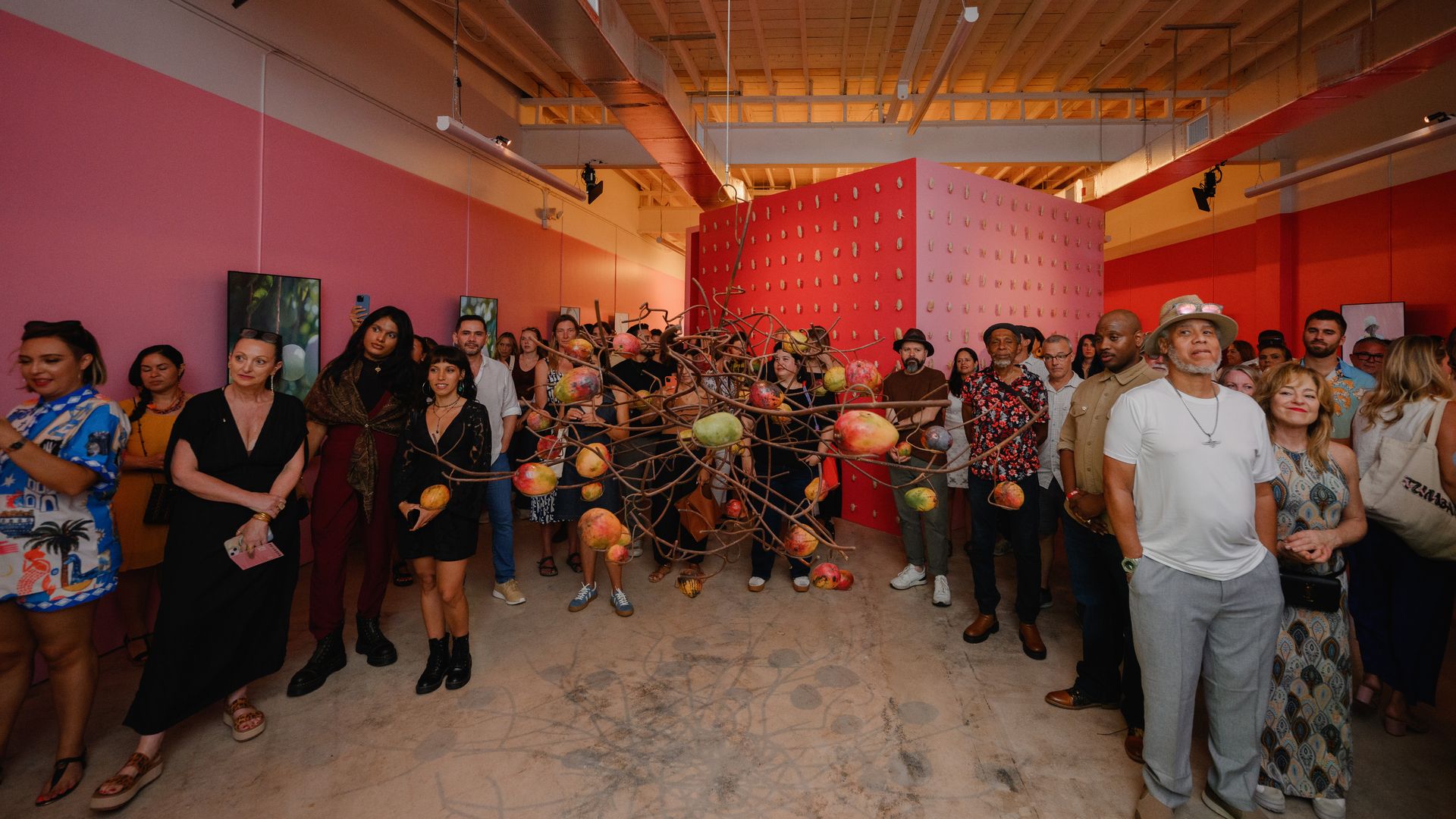 Visitors attend Jayme Kaye Gershen's art exhibit "When Mangoes Last in My Backyard Bloom'd." Photo: Carolina Menendez