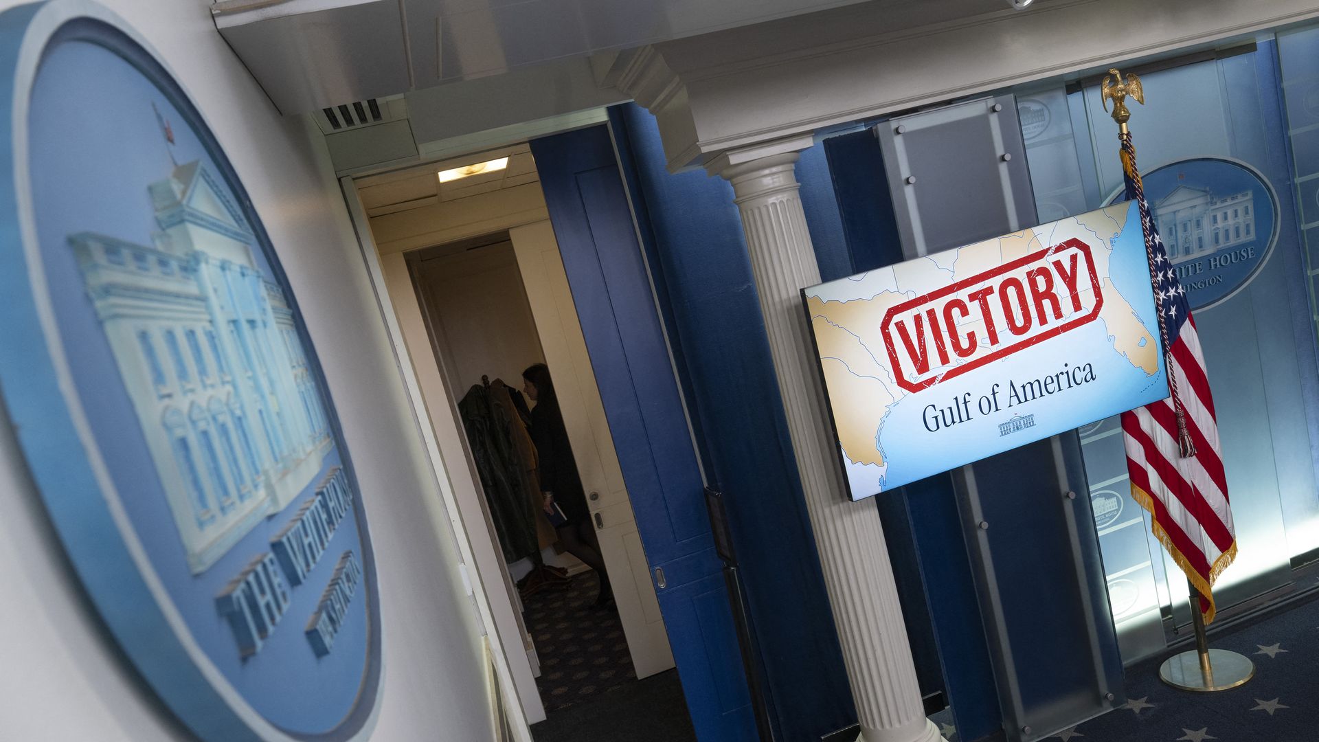 A "Victory" message is seen on a screen in a White House room 
