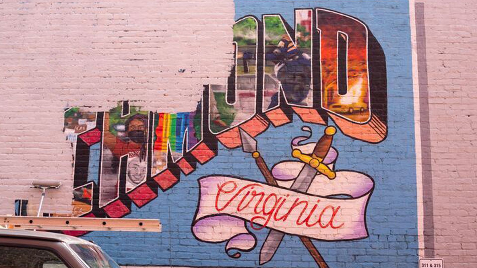 a mural that says "richmond virginia" being painted over with white paint