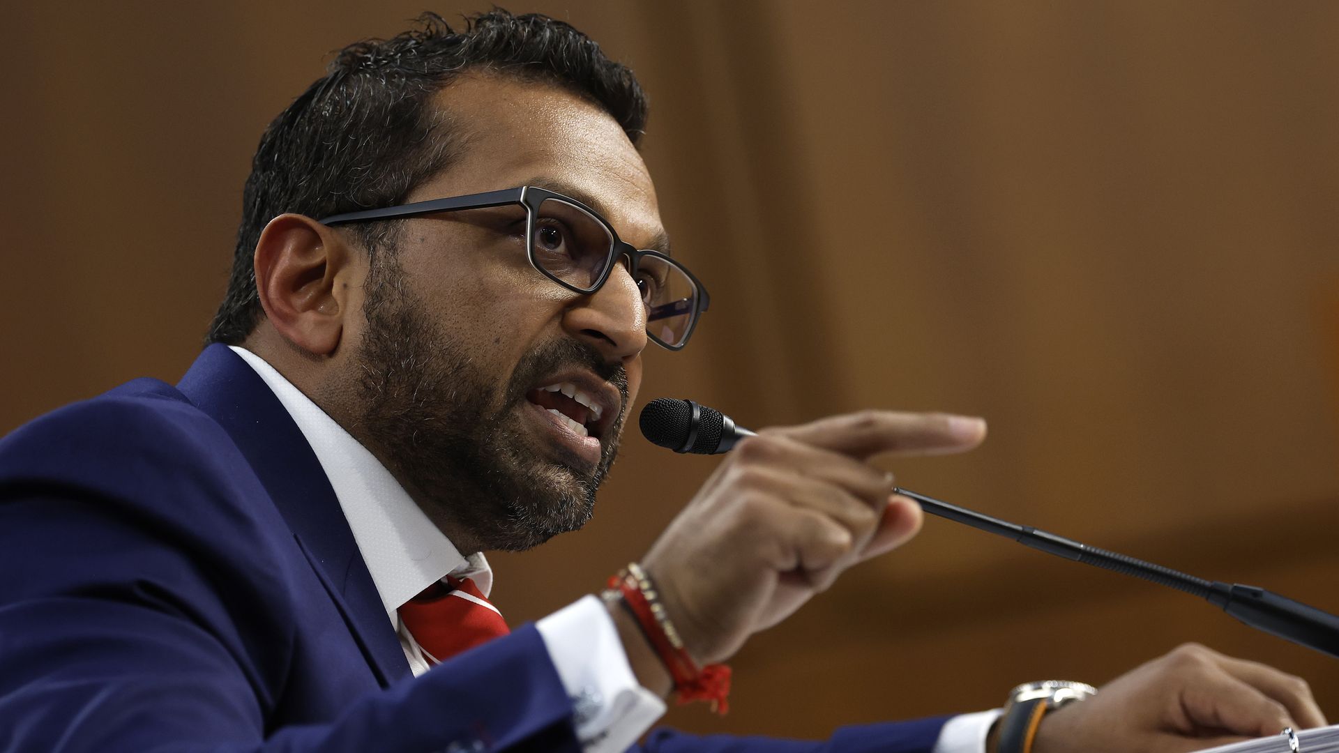 FBI Director Kash Patel speaks into a microphone during a Senate Judiciary Committee hearing on Capitol Hill.