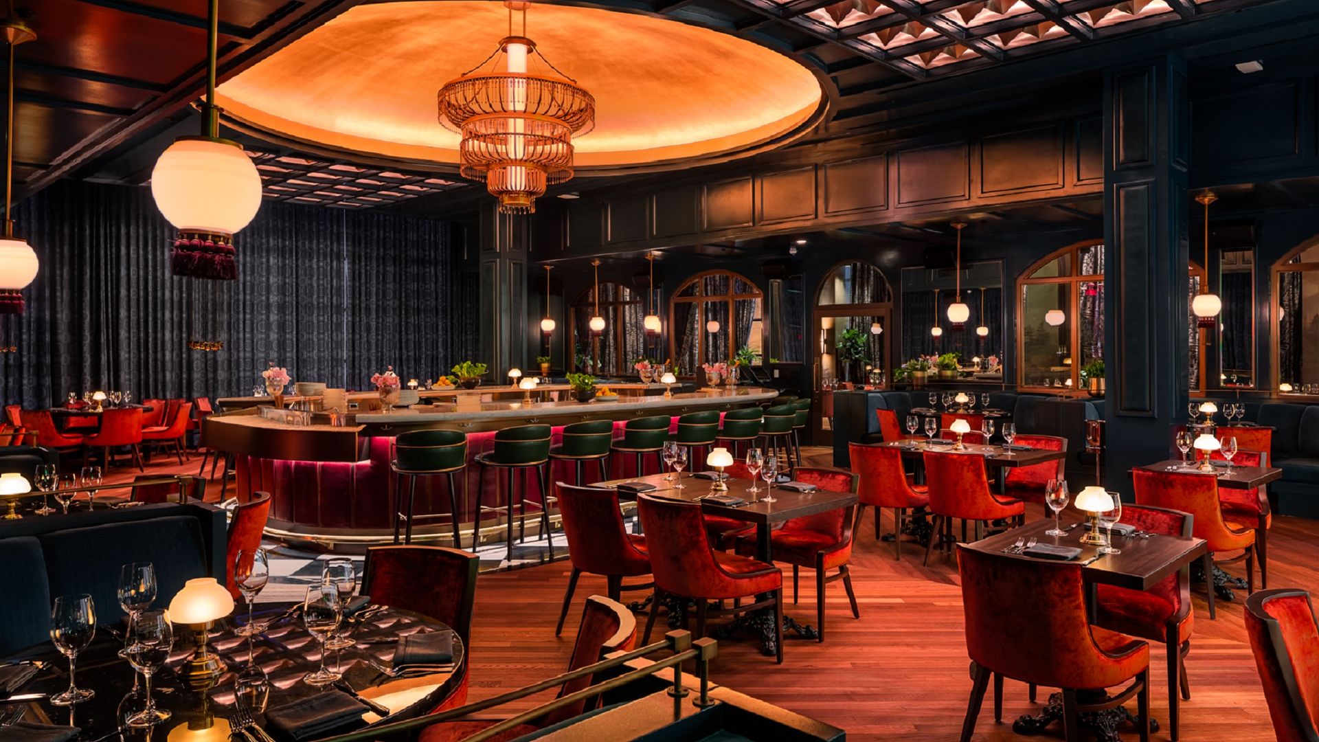 Image of the opulent Supper Club restaurant. It shows a center bar surrounded by tables.