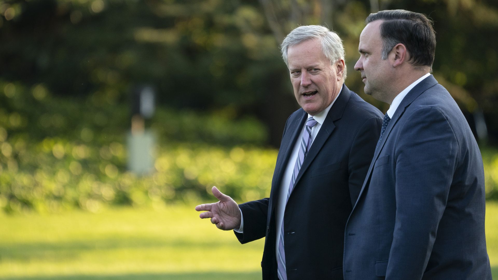 Former White House chief of staff Mark Meadows and former deputy chief of staff walking on the South Lawn in September 2020.