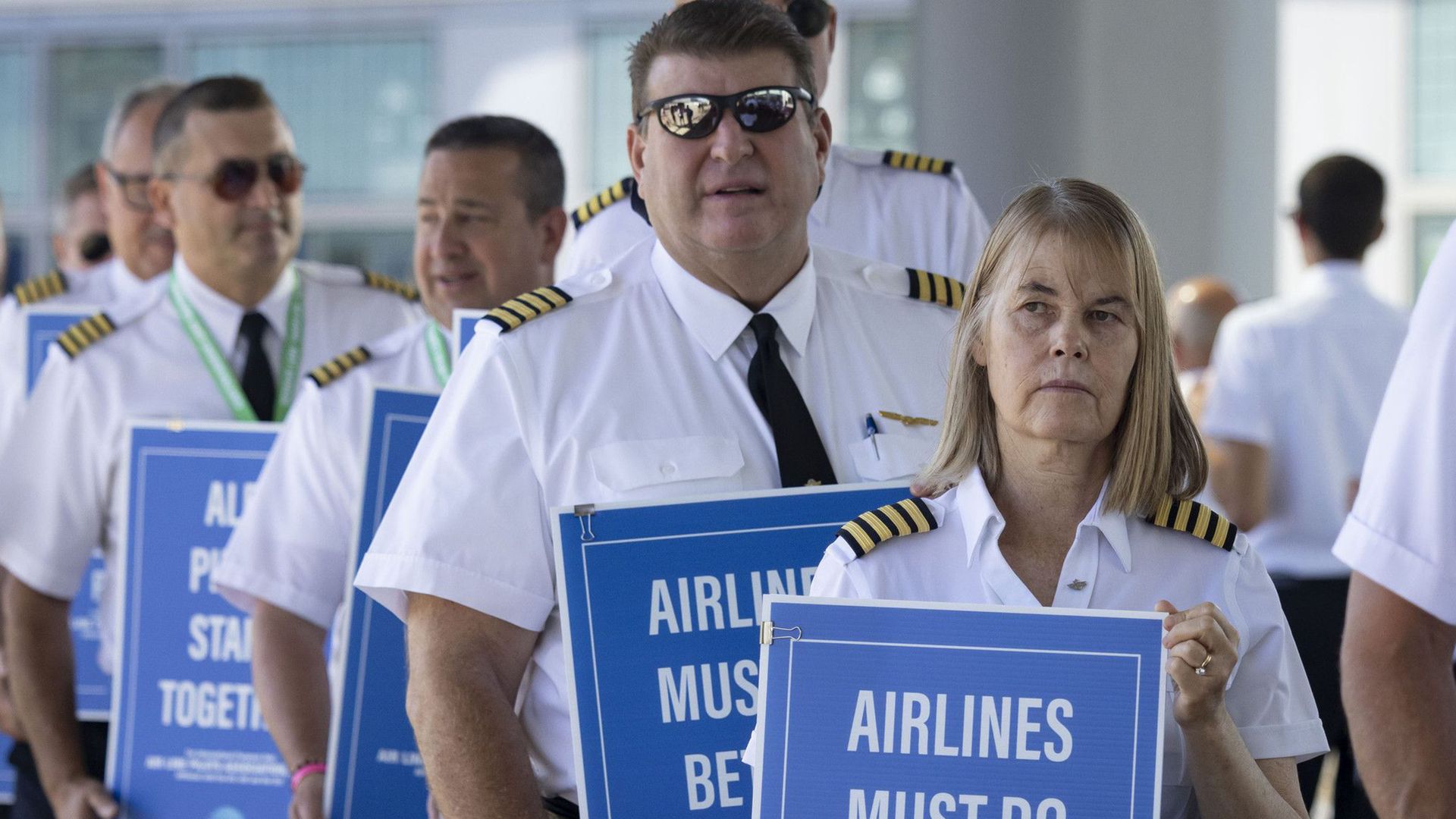 Airline pilots with ALPA National picket in Chicago.