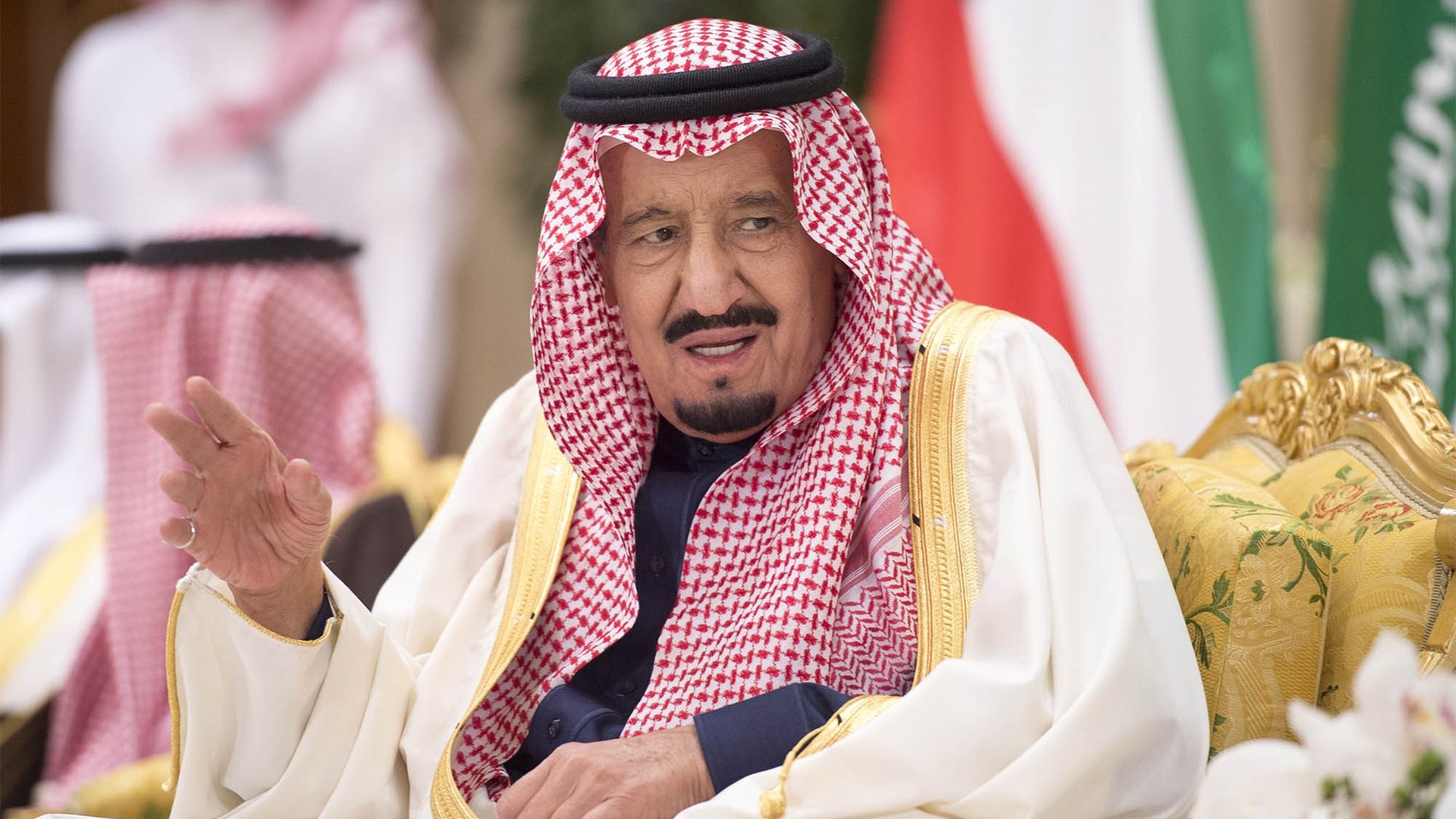 Saudi Arabian King Salman bin Abdulaziz Al Saud is speaking while sitting in a gold chair