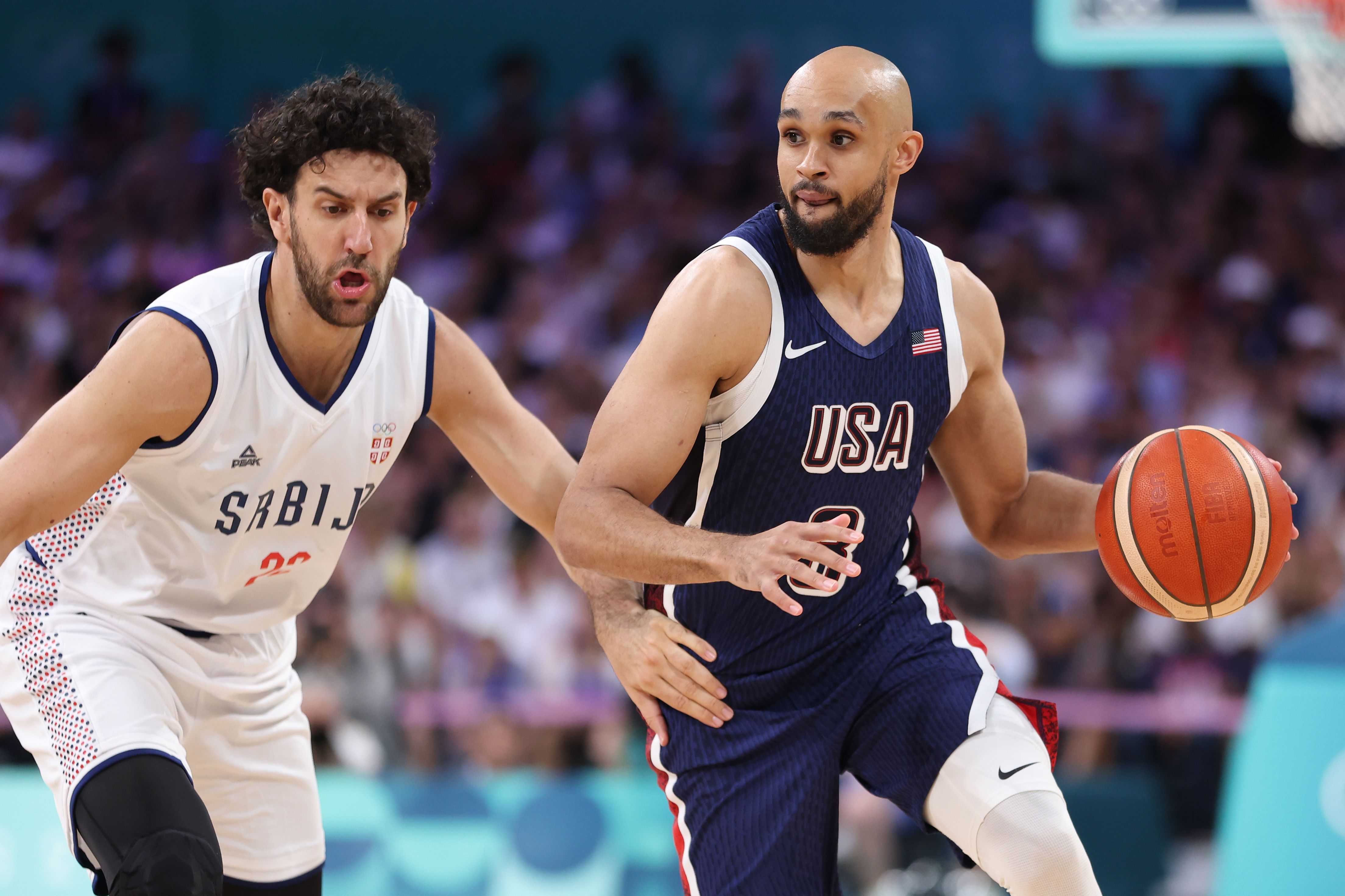 Team USA's Derrick White drives to the basket against Vasilije Micic of Serbia during a game July 28. Photo: Gregory Shamus/Getty Images