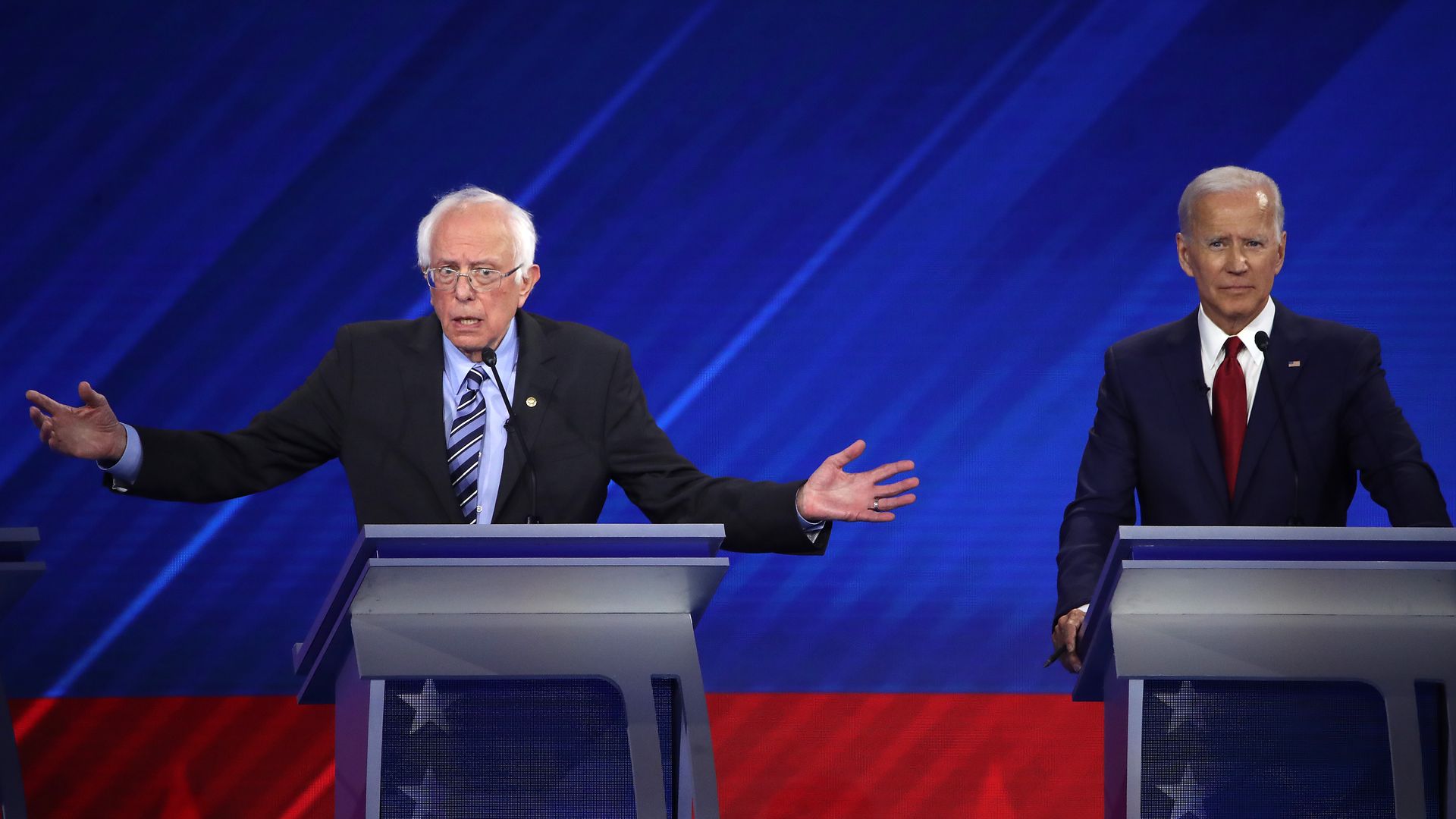 Sen. Bernie Sanders (I-VT) and former Vice President Joe Biden interact during the Democratic Presidential Debate at Texas Southern University's Health and PE Center on September 12