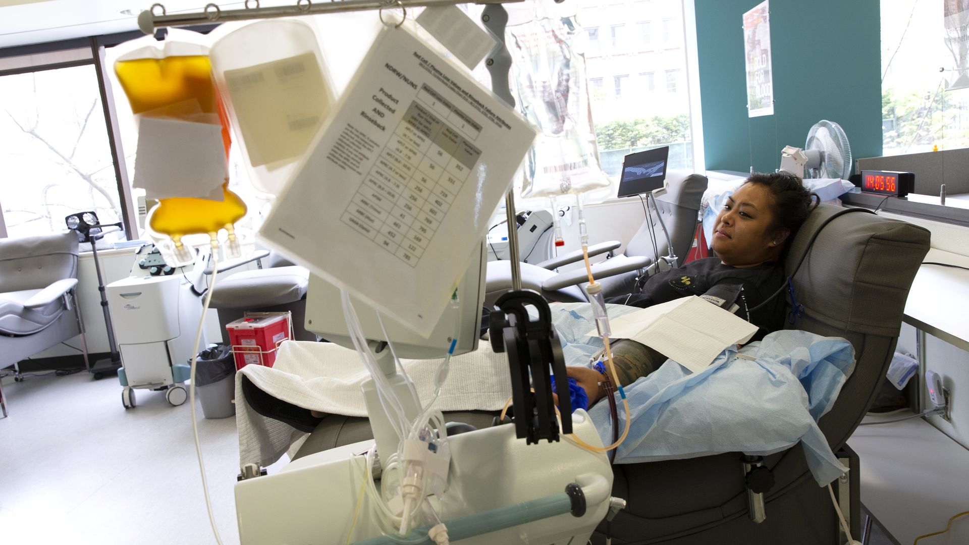 Photo of a woman donating convalescent plasma for COVID-19 patients