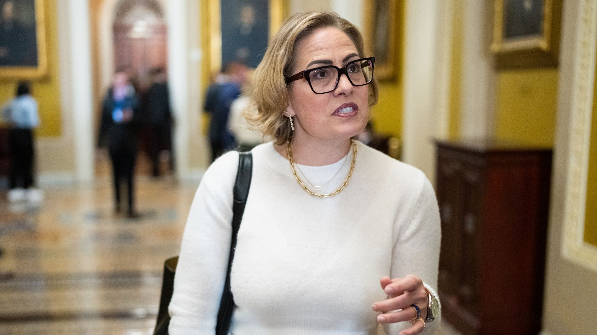 Former Sen. Kyrsten Sinema, I-Ariz., speaks to reporters in the Ohio Clock Corridor in the U.S. Capitol