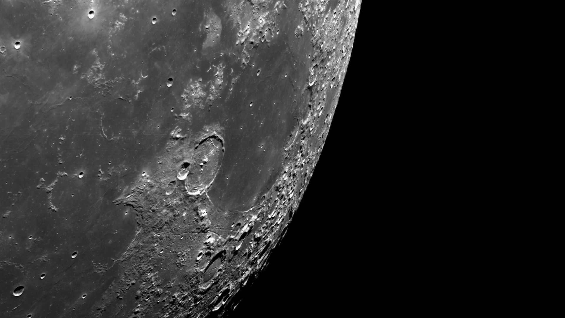 The Moon's craters stand out against the black backdrop of space
