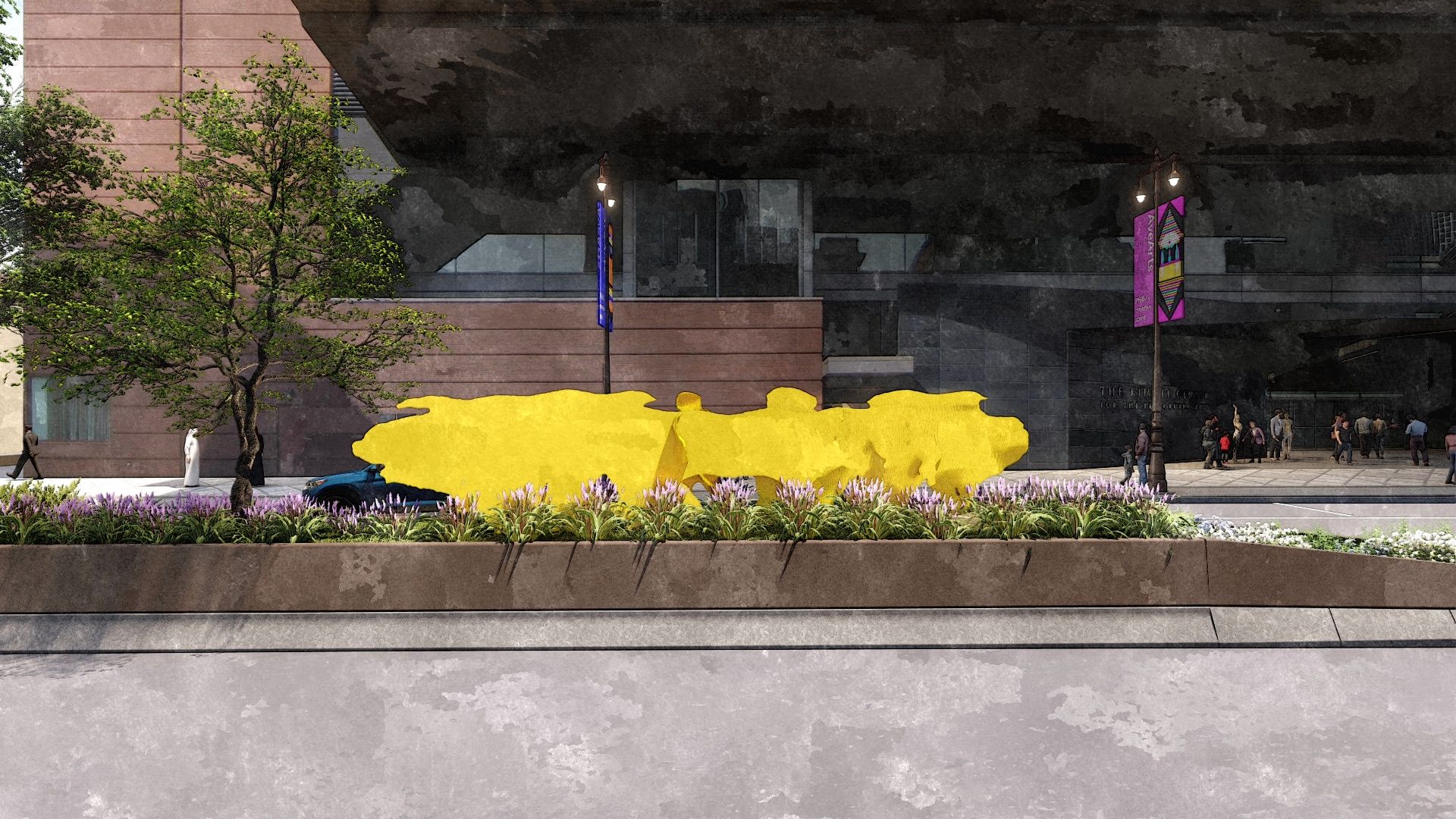 Urban plaza with a brown brick building, a bright yellow abstract sculpture across a planter bed, a green tree, purple flowers, and pedestrians near a dark building entrance under an overpass.