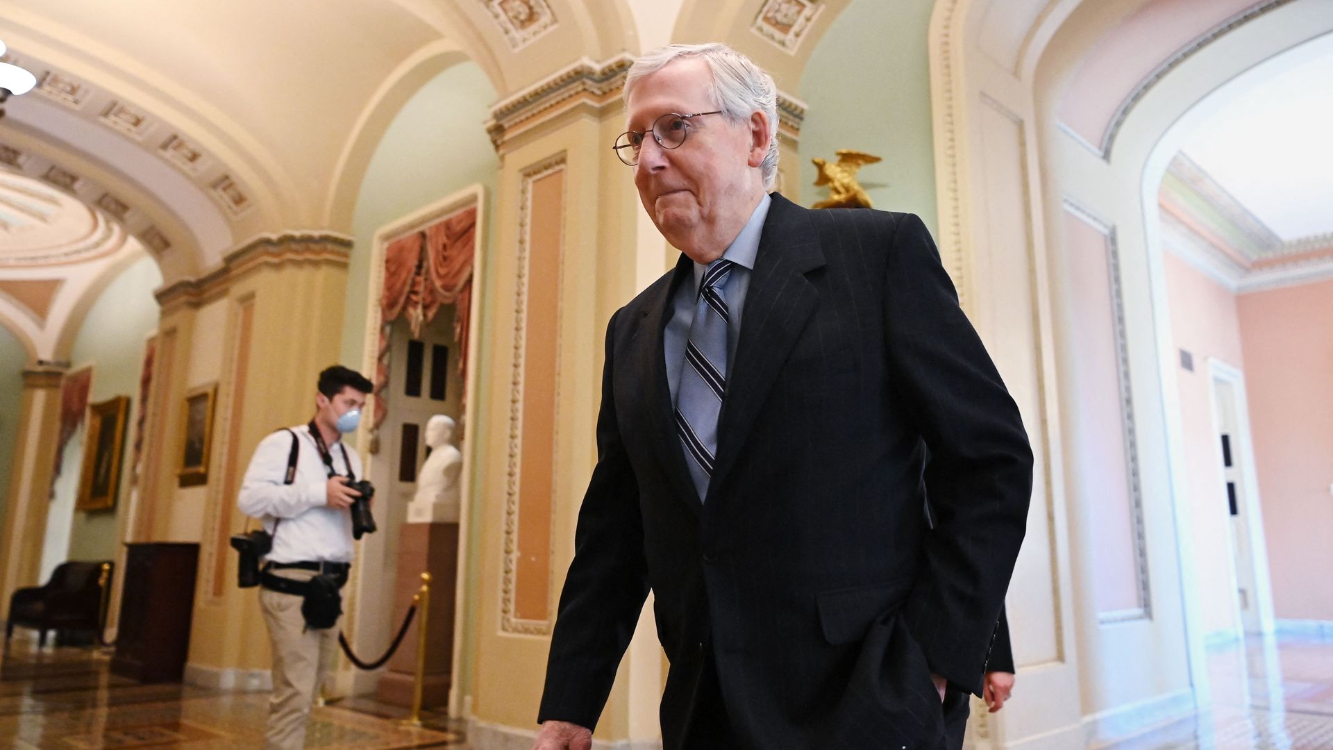 Senate Minority Leader Mitch McConnell, Republican of Kentucky, makes his way to the Senate chamber during the Senate vote-a-rama