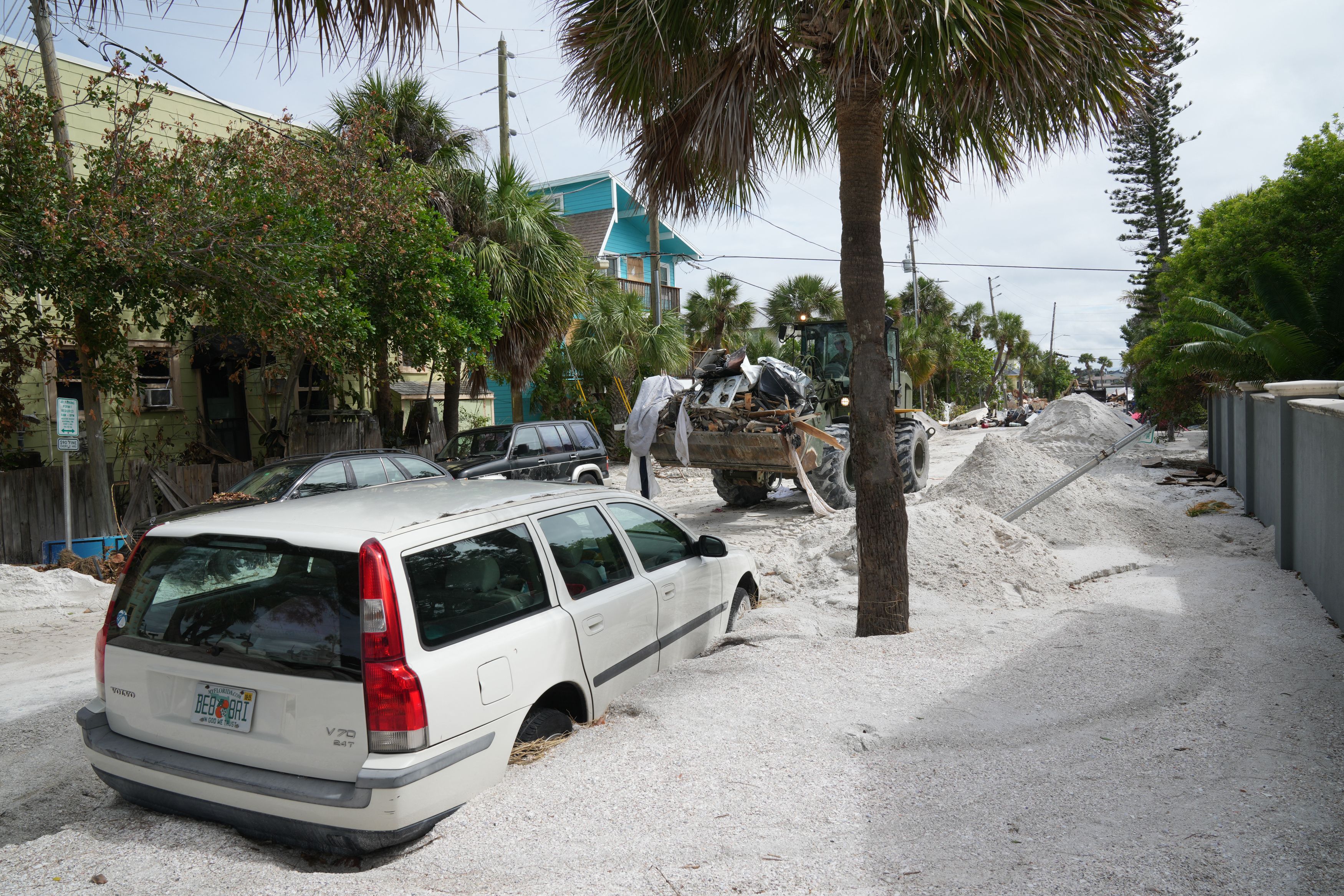 A Florida Army National Guard loader moves debris from the Pass-A-Grille section of St. Petersburg ahead of Hurricane Milton's expected landfall in the middle of this week on October 7, 2024 in Florida. Florida's governor has declared a state of emergency on Saturday as forecasters warned that Hurri