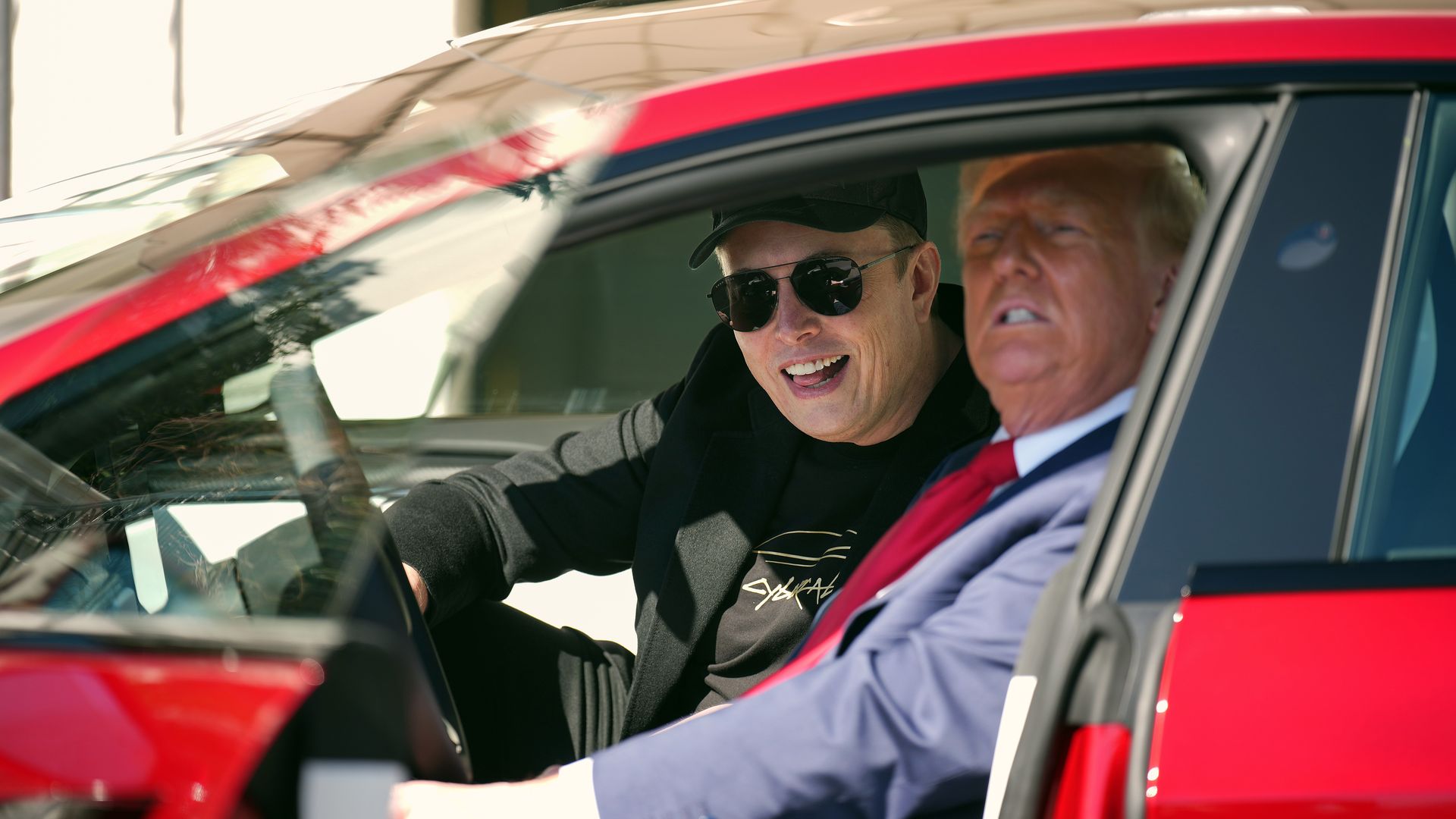 President Donald Trump and White House Senior Advisor, Tesla and SpaceX CEO Elon Musk sit in a Model S on the South Lawn of the White House on March 11.