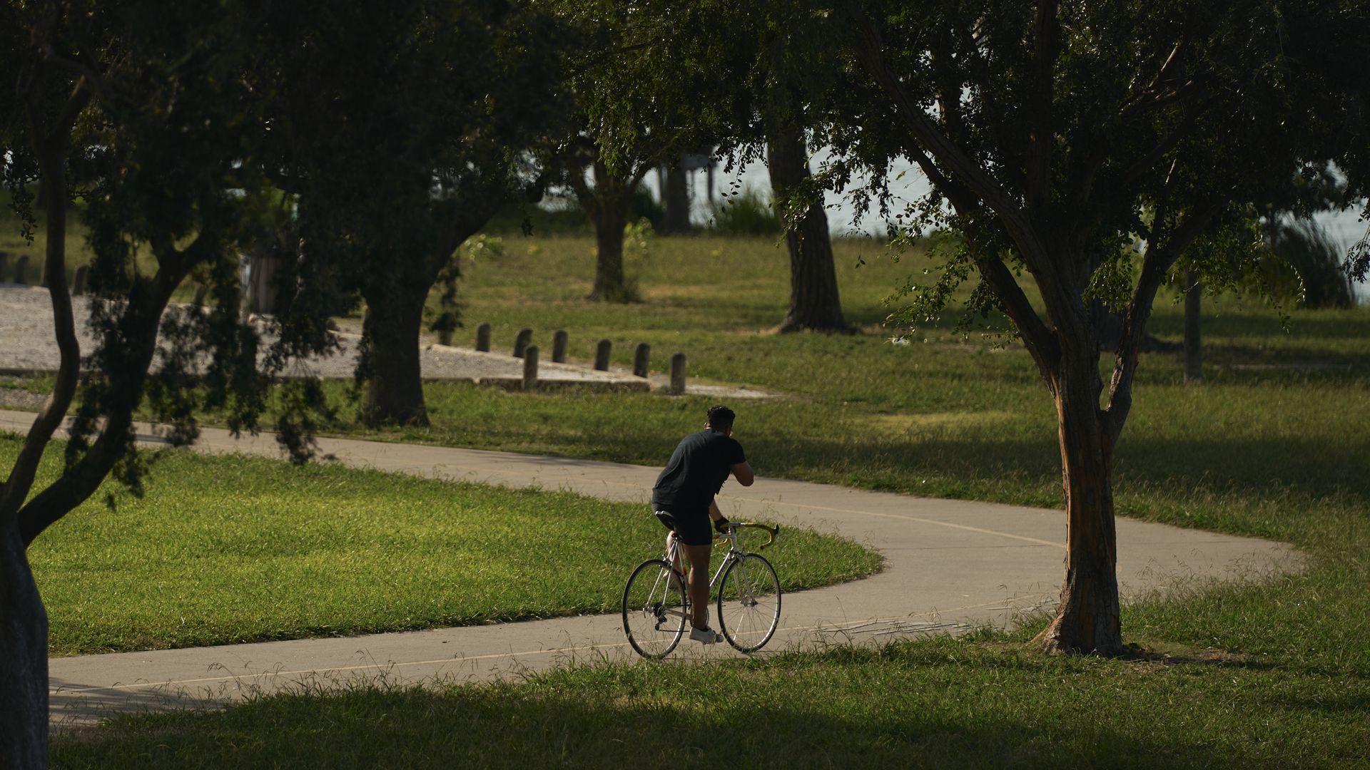 a photo of a person on a bike at White Rock Lake