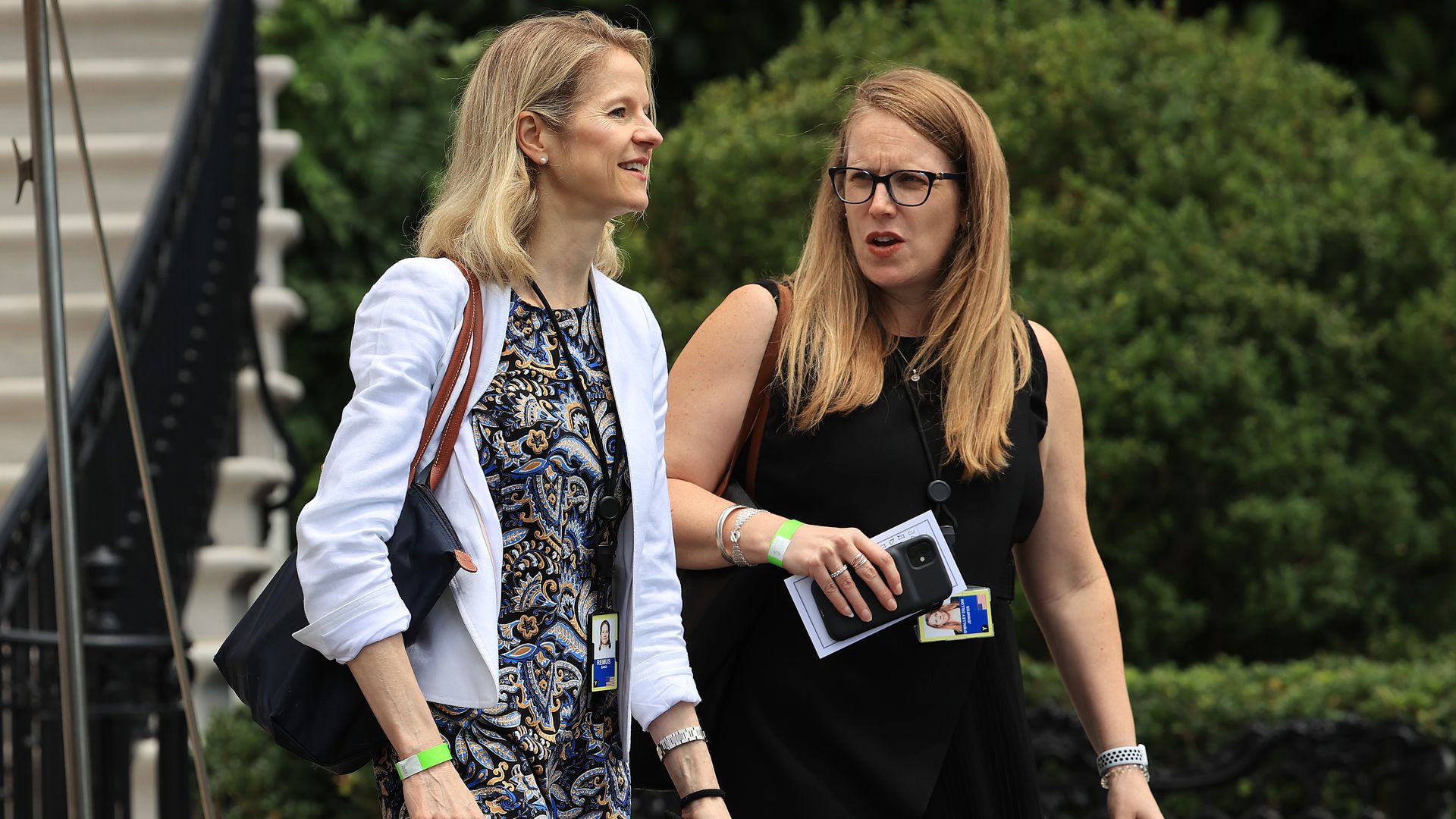 White House Deputy Chief of Staff Jennifer O'Malley Dillon is seen speaking with White House counsel Dana Remus last July