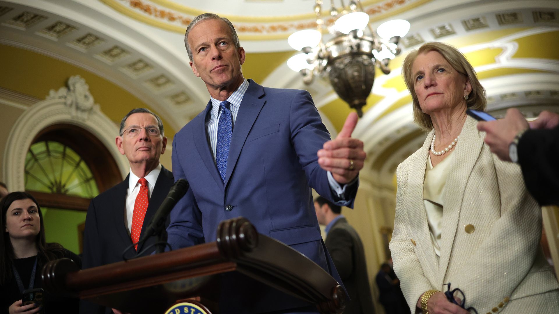 Senate Majority Leader John Thune (R-SD), joined by Sen. Shelley Moore Capito (R-WV) and Sen. John Barrasso (R-WY), speaks to the media following the weekly Senate policy luncheons at the U.S. Capitol