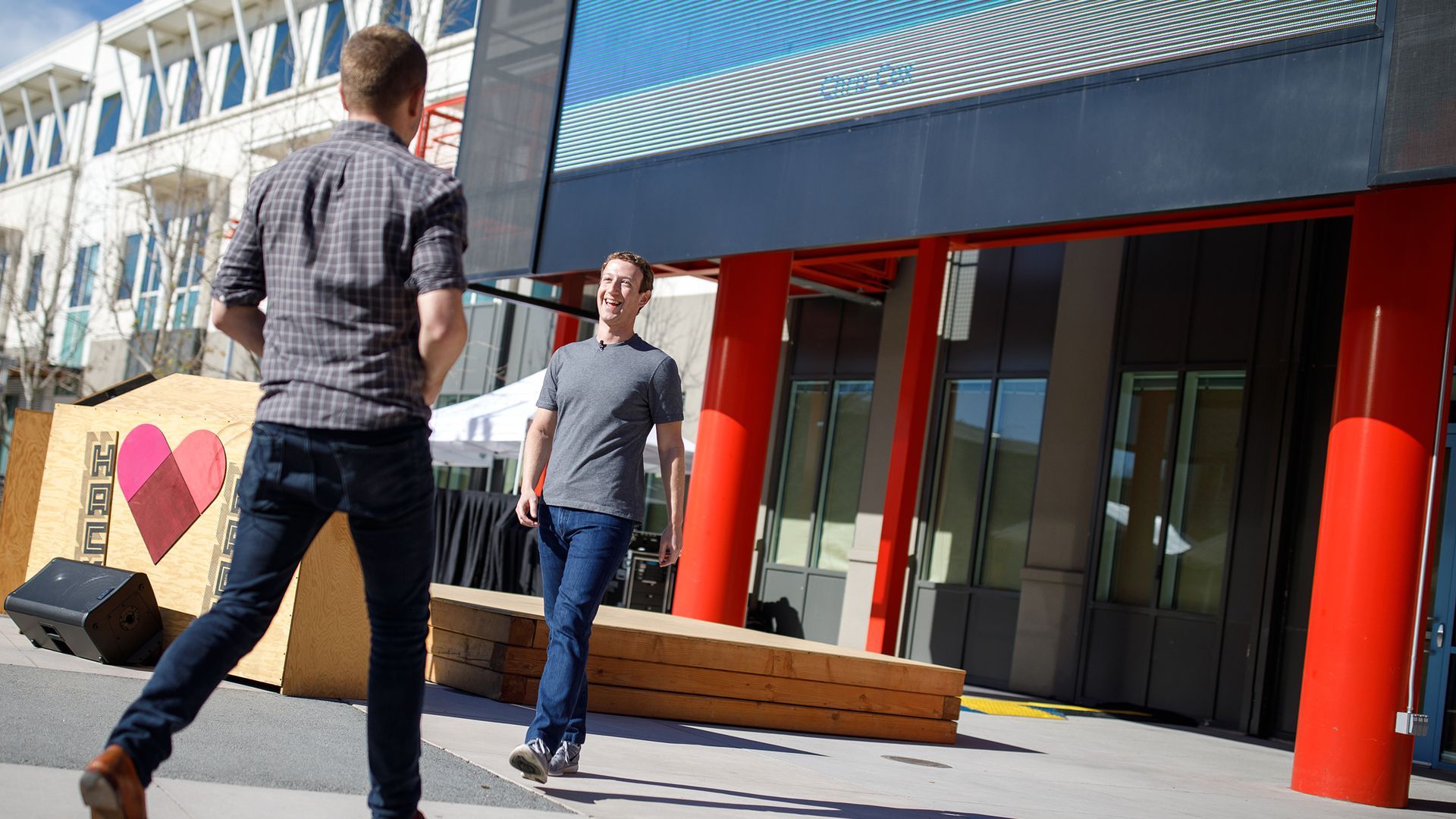 Chris Cox crosses paths with Mark Zuckerberg at a Facebook staff meeting.