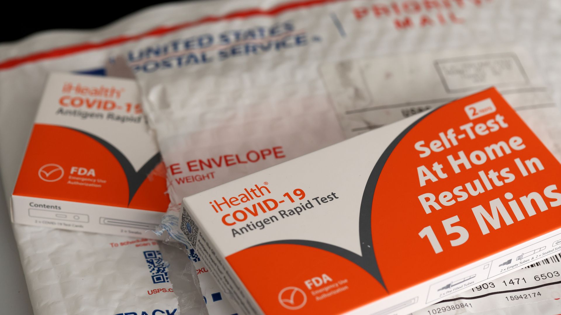 COVID test kits with United States Postal Service padded envelope