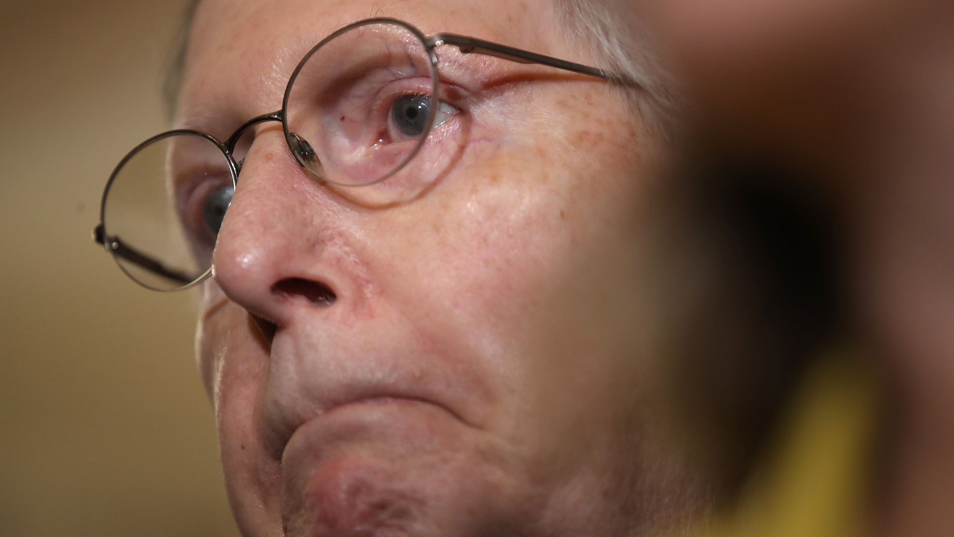 this image is a close up of Mitch McConnell's face
