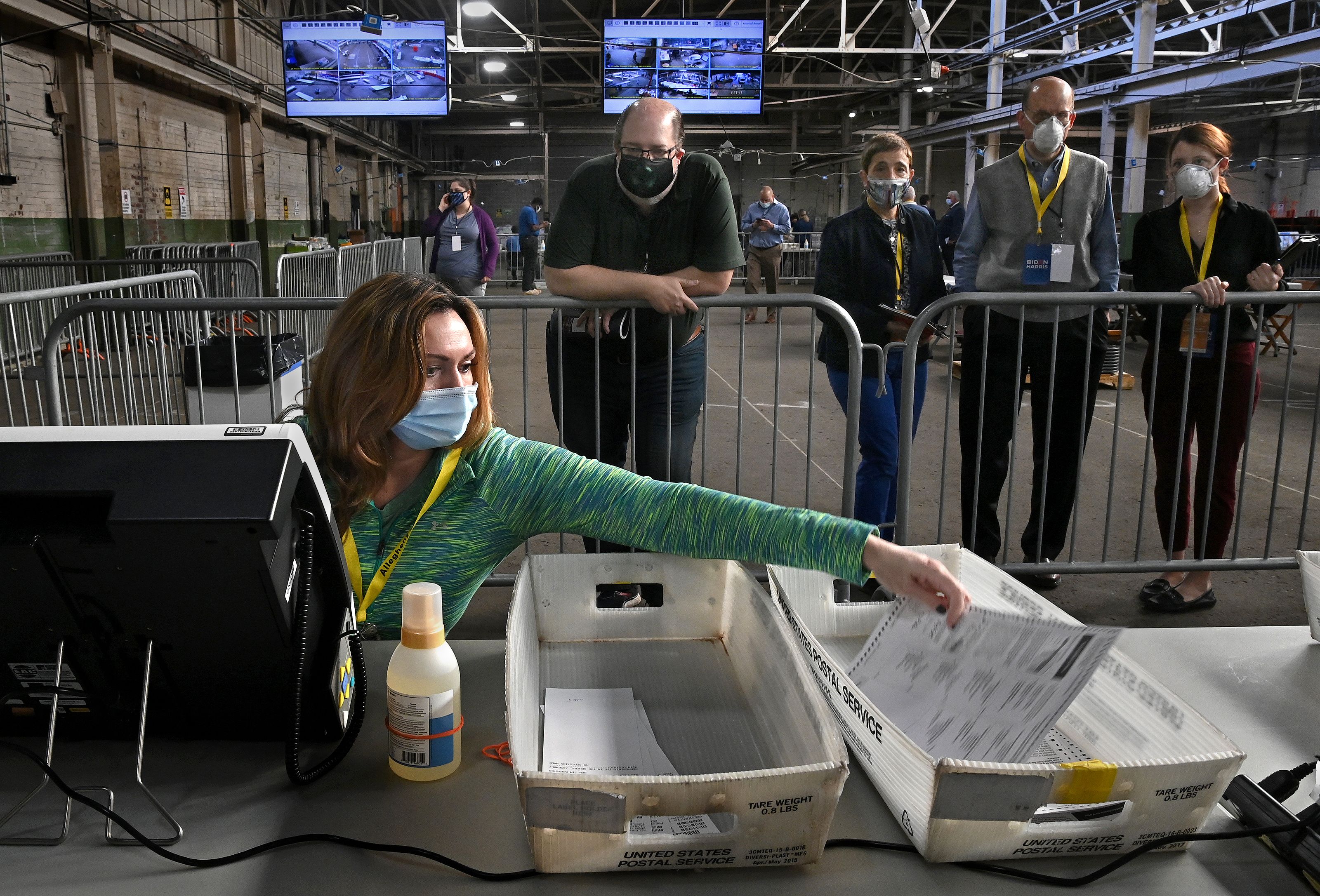 A return board member files a ballot after it was double checked in Pittsburgh, Pennsylvania on Friday. Photo: Michael S. Williamson/The Washington Post via Getty Images