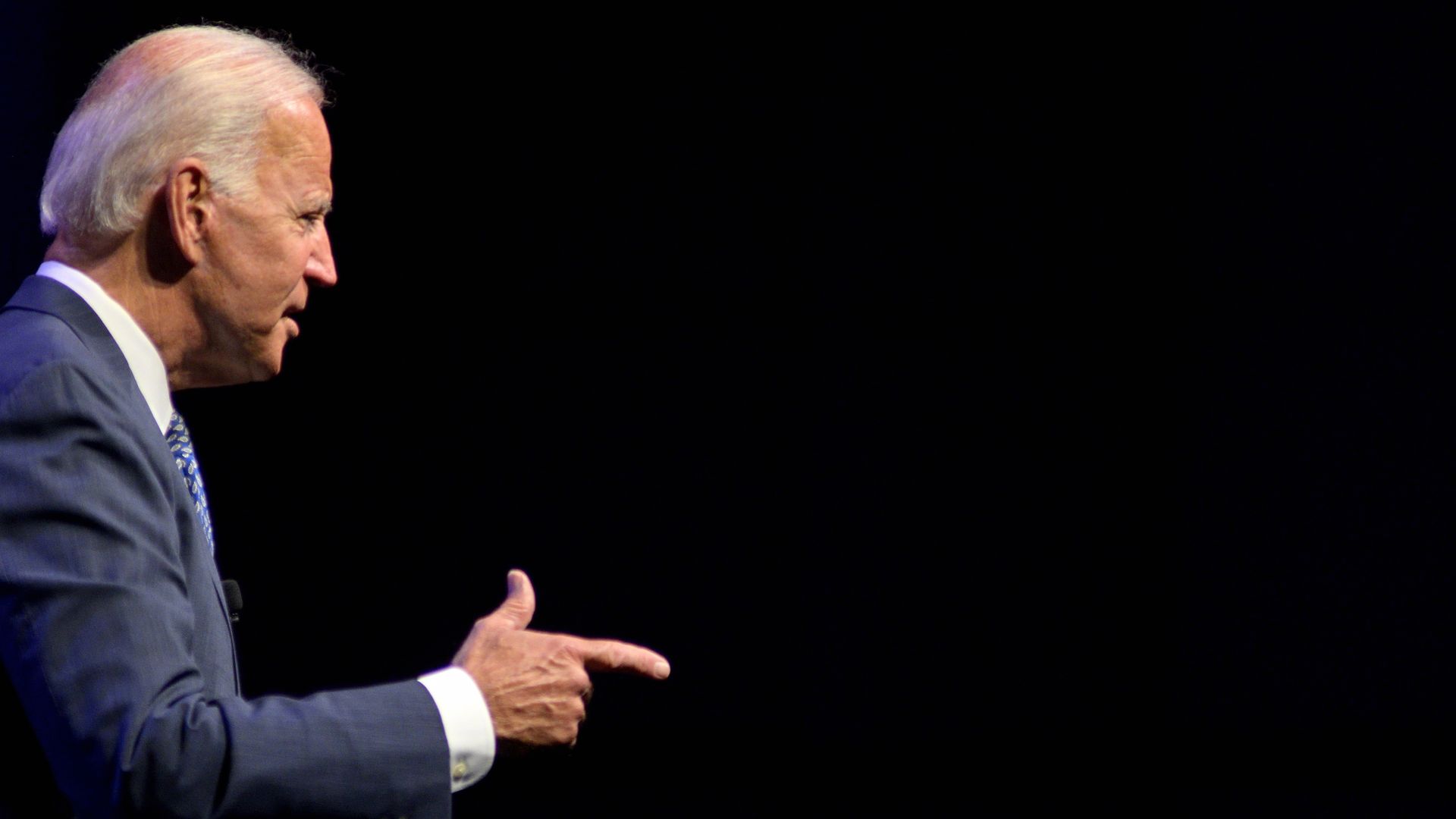 This image shows a picture of Biden pointing while standing