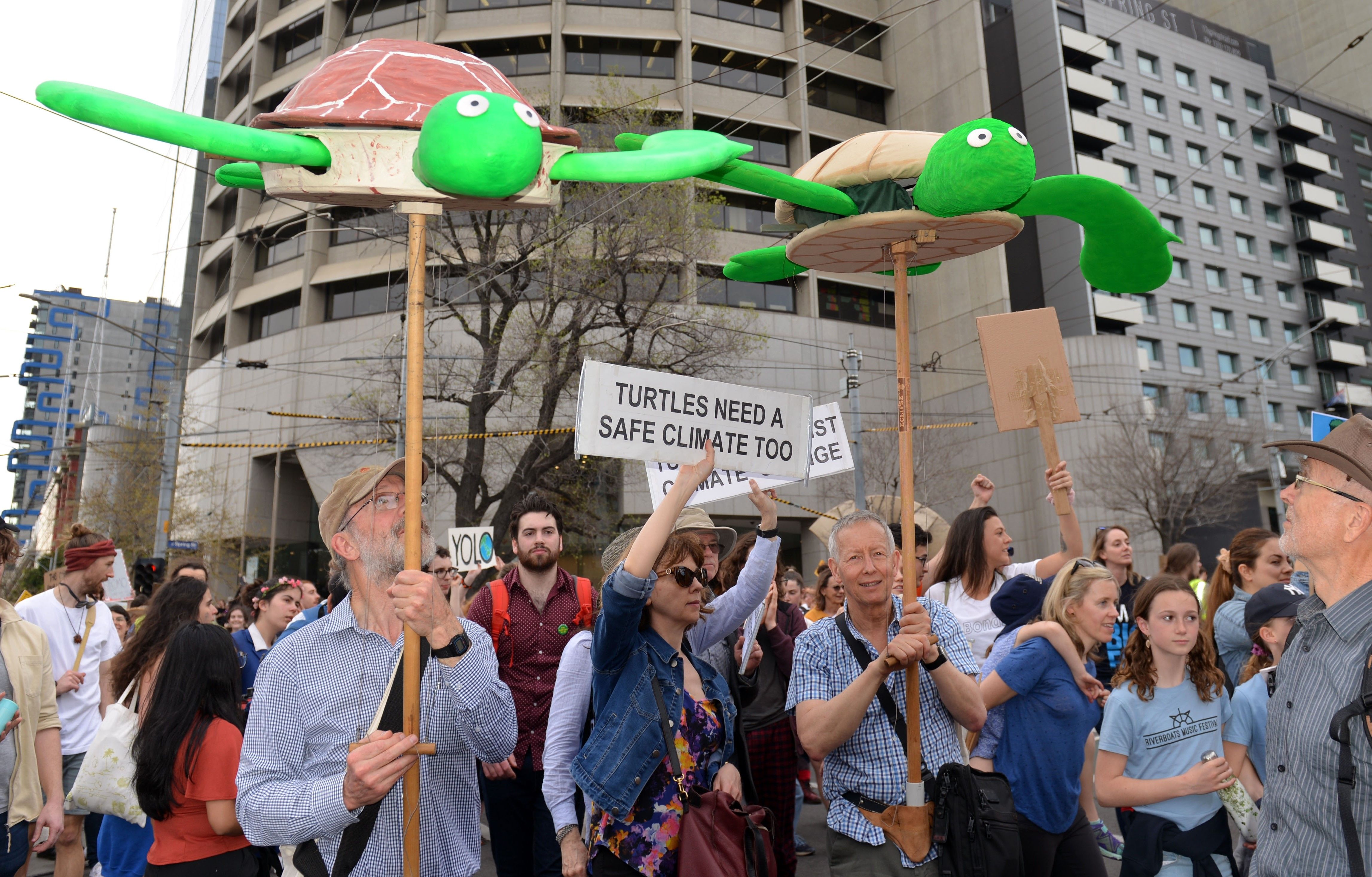 Environmentalist gather holding banners on a demonstration during Climate Strike in Australia
