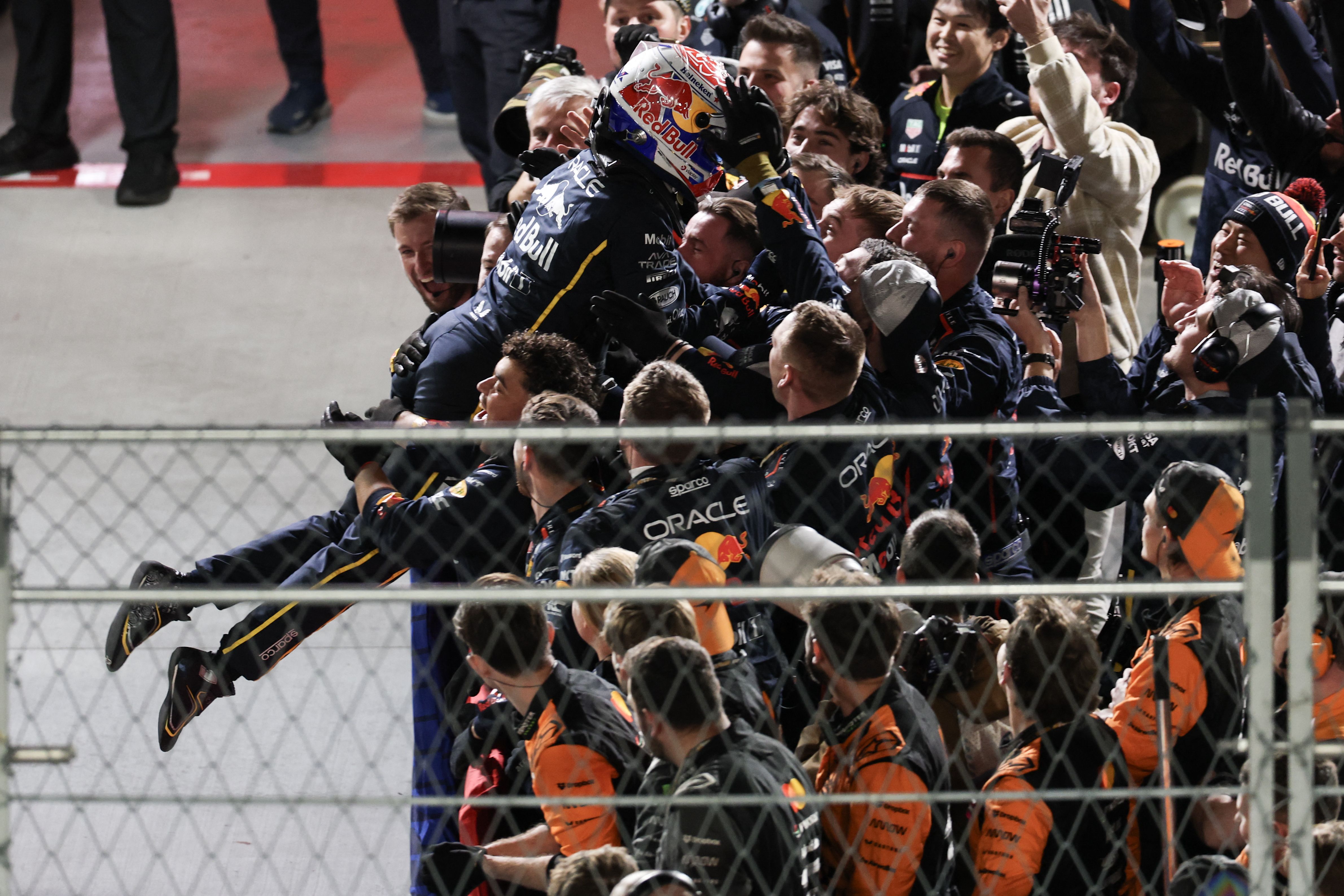 Las Vegas Formula One Grand Prix winner celebrates by jumping into group of teammates