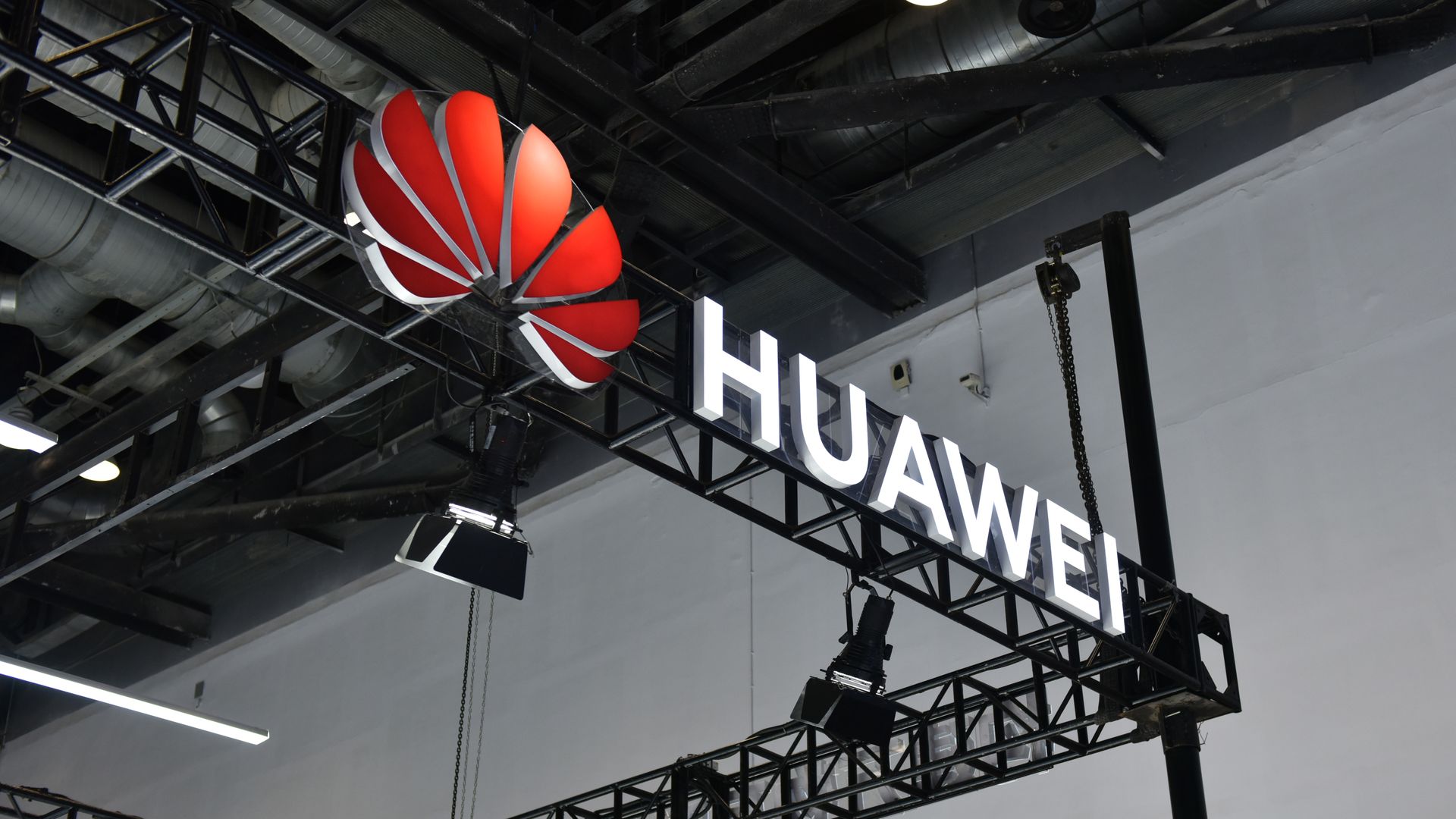 Photo of a large Huawei sign and its red logo
