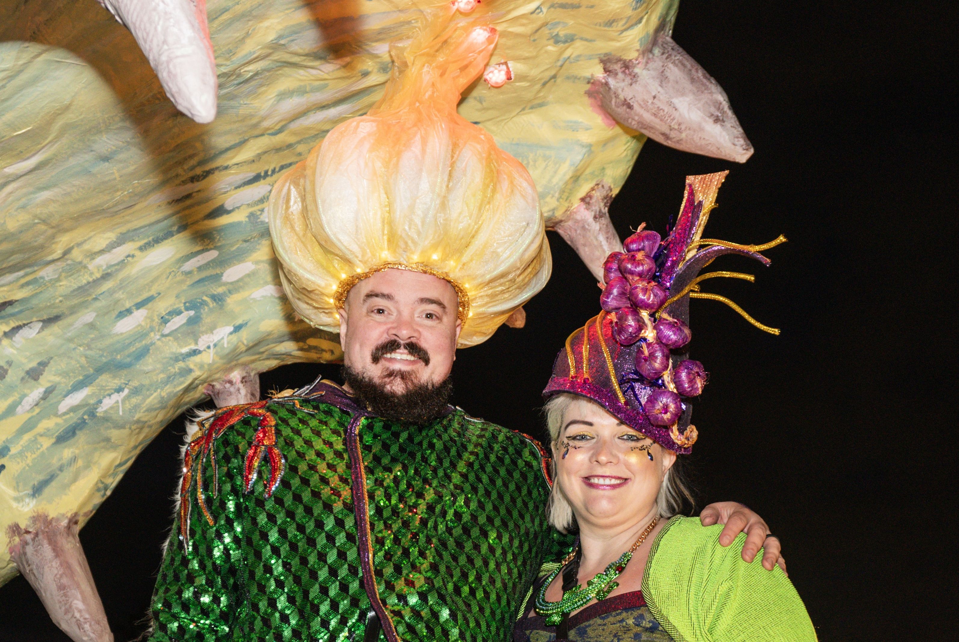 Photo shows Isaac and Amanda Toups in costume on a float