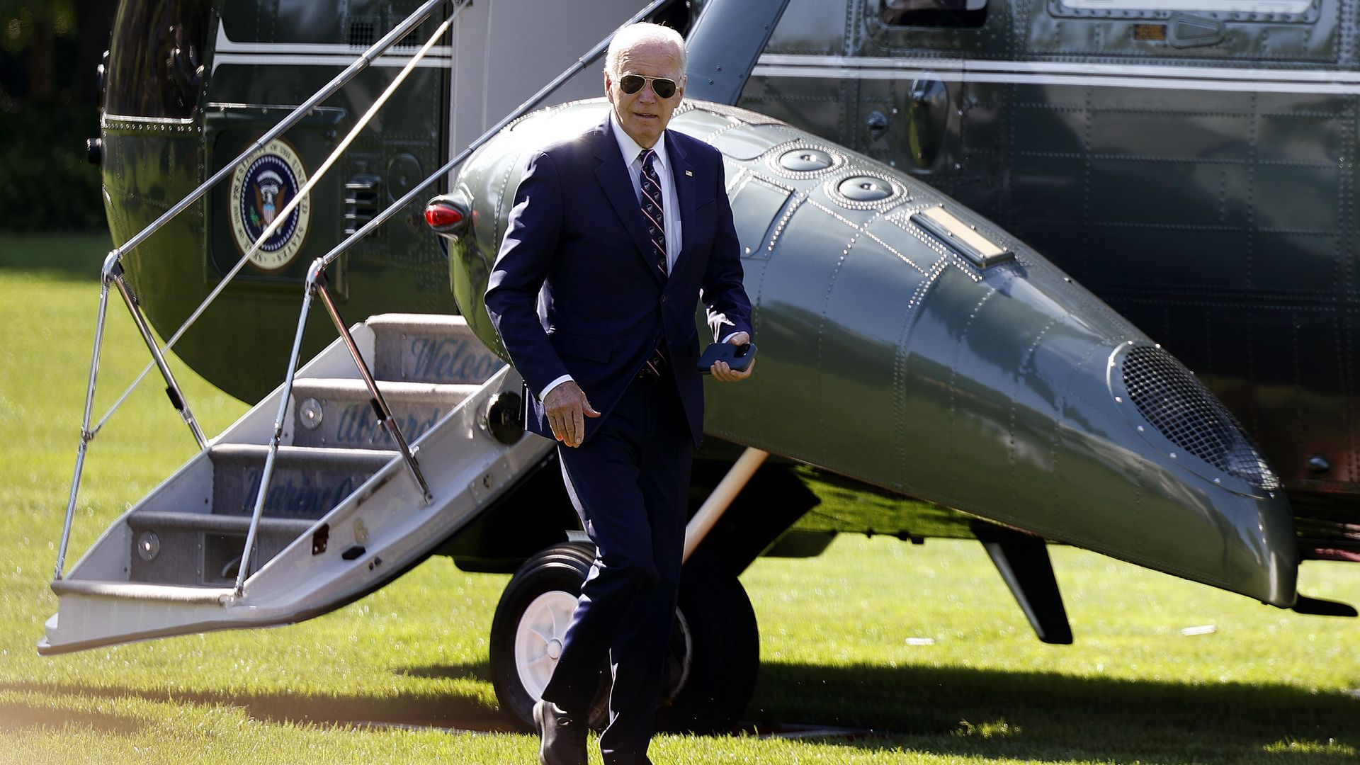 Photo shows President Joe Biden leaving a helicopter at the White House.