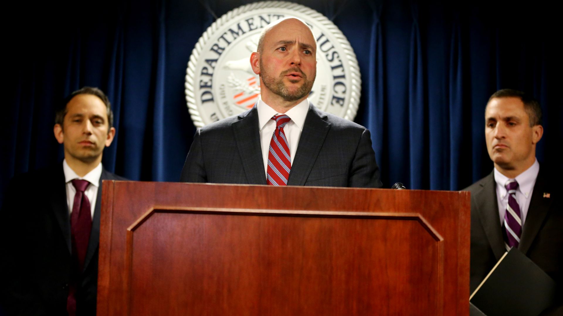 U.S. Attorney Andrew E. Lelling announcing charges against dozens of individuals involved in a nationwide college admissions cheating and recruitment scheme.
