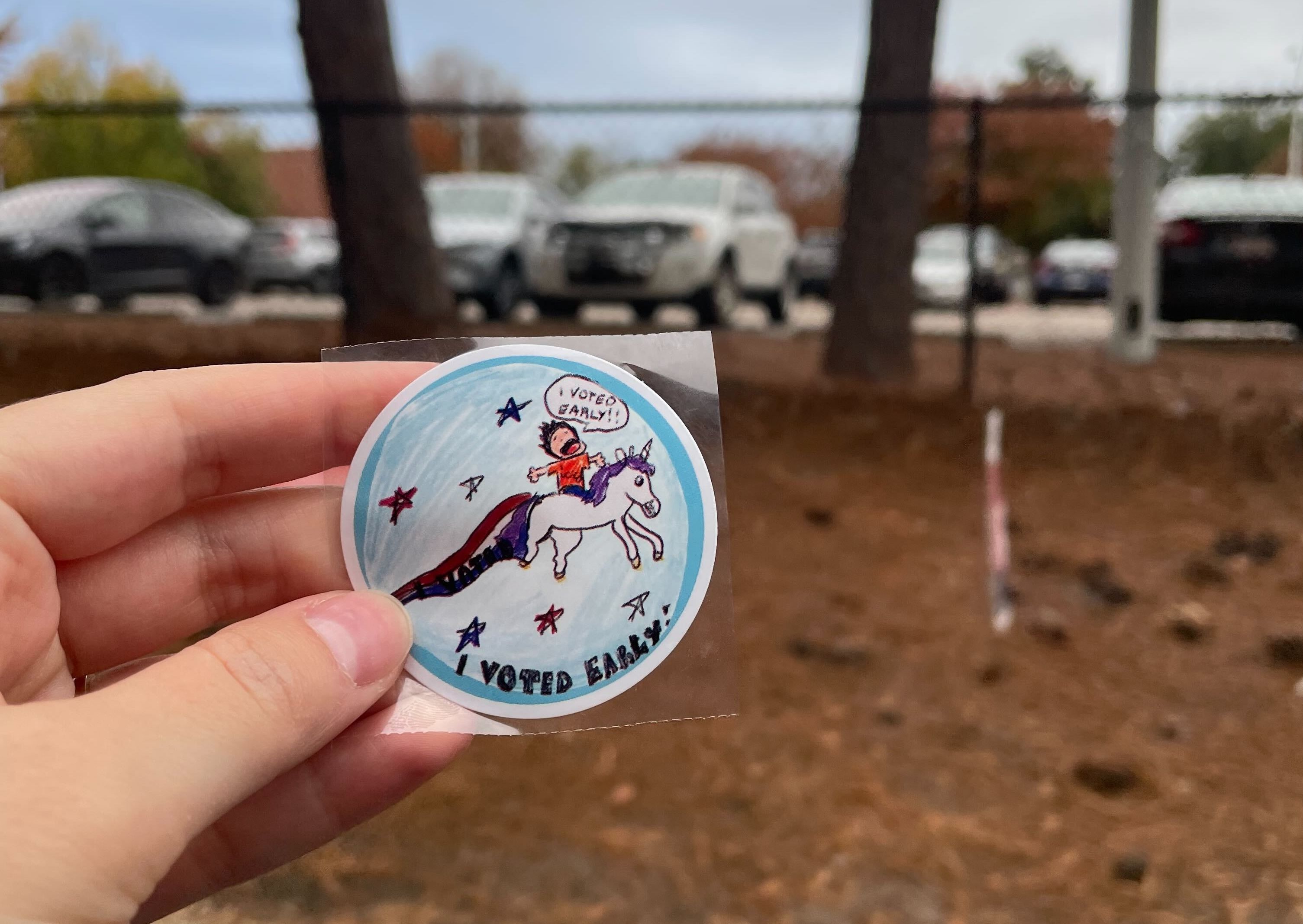 Photo shows a voter sticker with a unicorn.