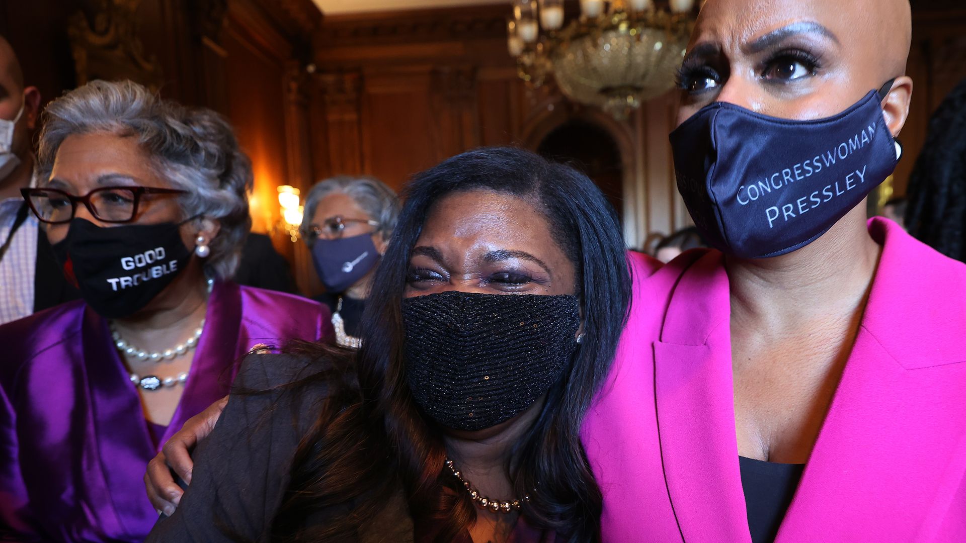 Rep. Cori Bush (D-MO) (C) and Rep. Ayanna Pressley (D-MA) walk with their arms around each other after the Chauvin verdict