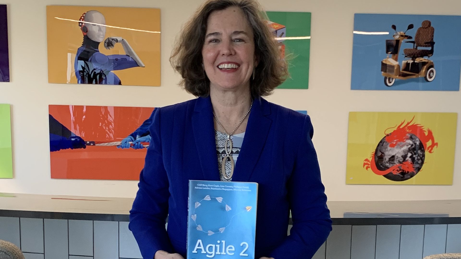 Lisa Cooney with Agile 2, the book she co-authored.