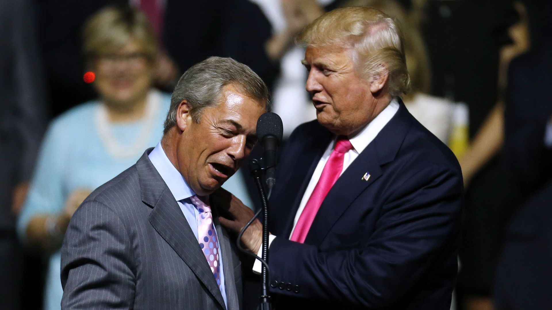 Then-Republican Presidential nominee Donald Trump, right, greets then-UKIP leader Nigel Farage during a campaign rally at the Mississippi Coliseum on August 24, 2016 in Jackson, Mississippi. 