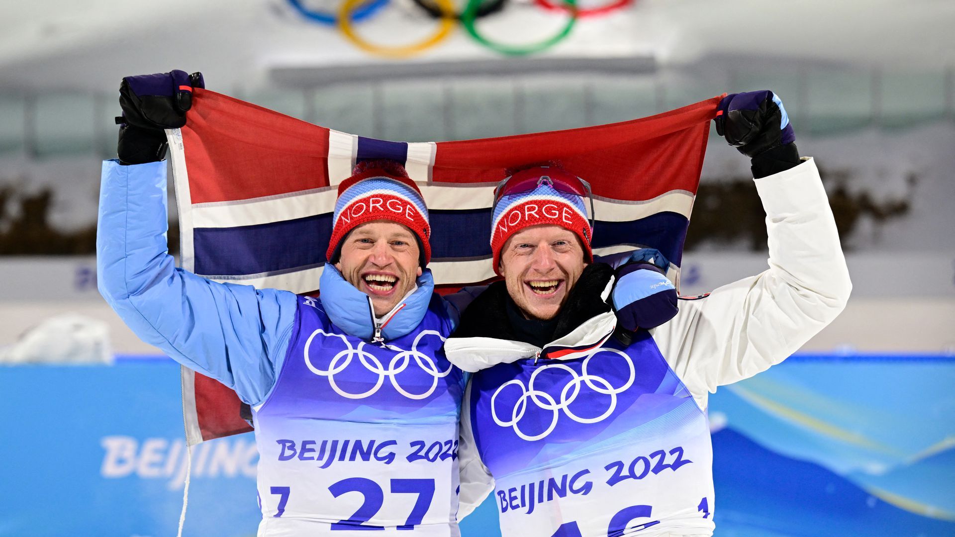 Norwegian Olympians hold their country's flag.