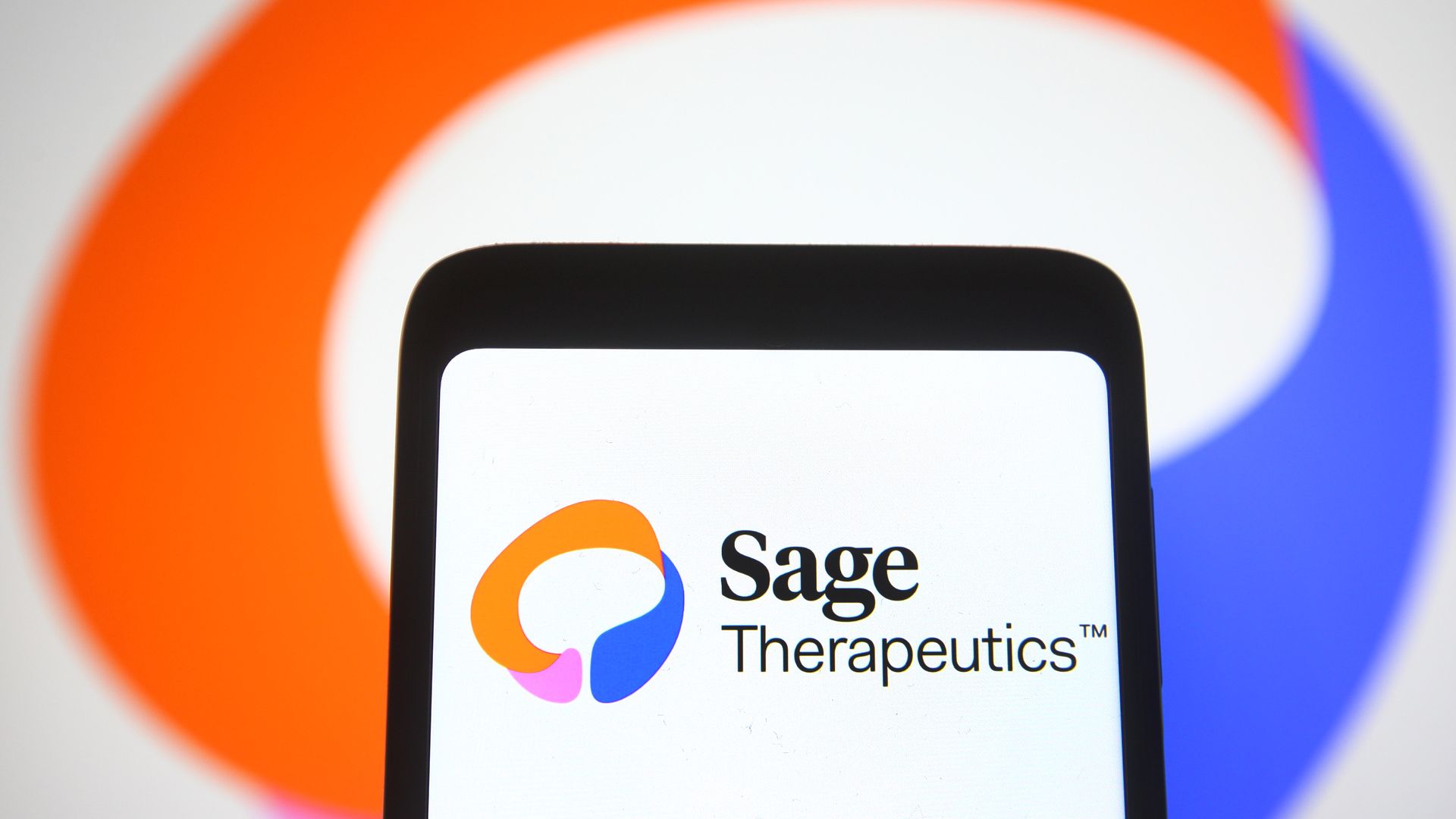 Photo illustration of Sage's logo on a smartphone.