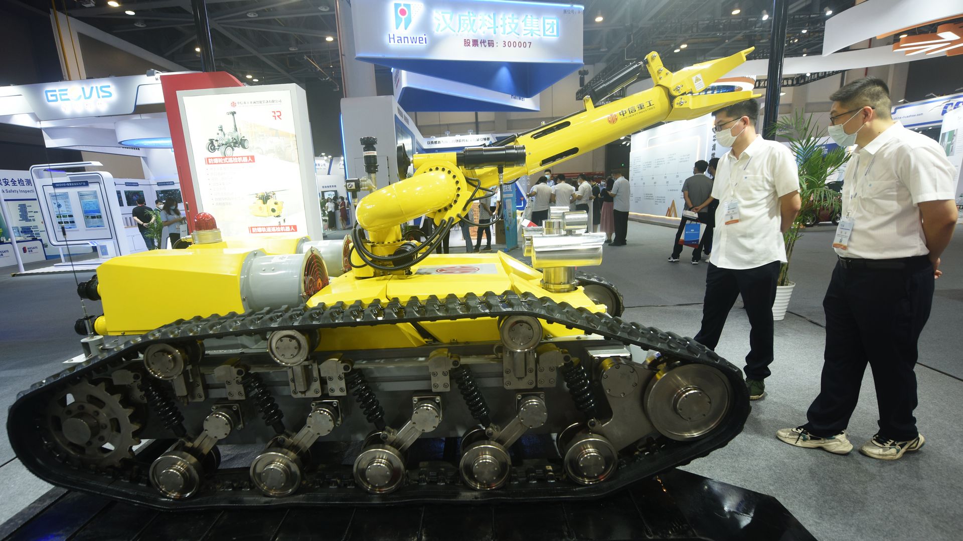 isitors look at a fire extinguishing reconnaissance robot displayed by Citic Heavy Industries at the 2022 International Safety and Emergency Response Expo in Hangzhou, Zhejiang province, China.