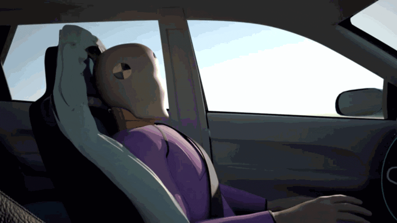 Car seat expanding to create a cushion around a crash dummy. 