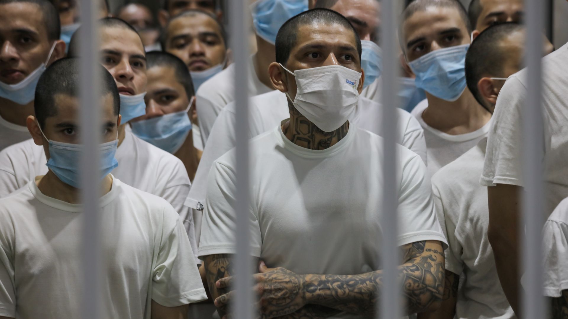 Men stand in a crowded cell in a Salvadorian prison.