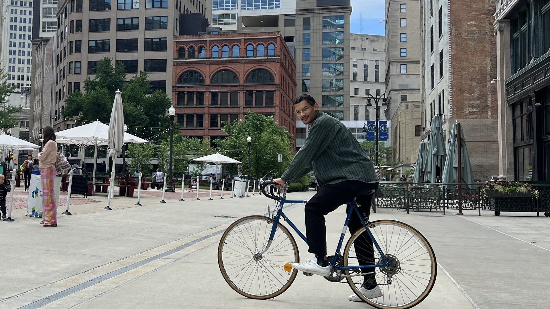 Axios reporter Samuel Robinson poses on his bike